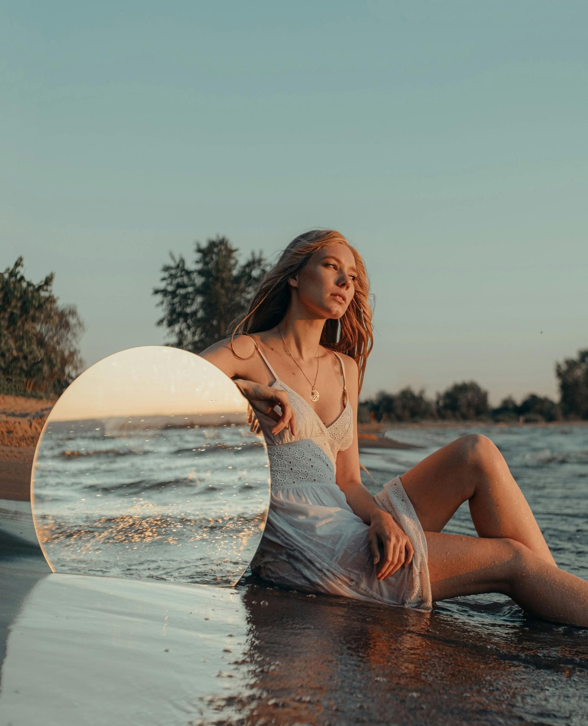 woman standing in front of white wall