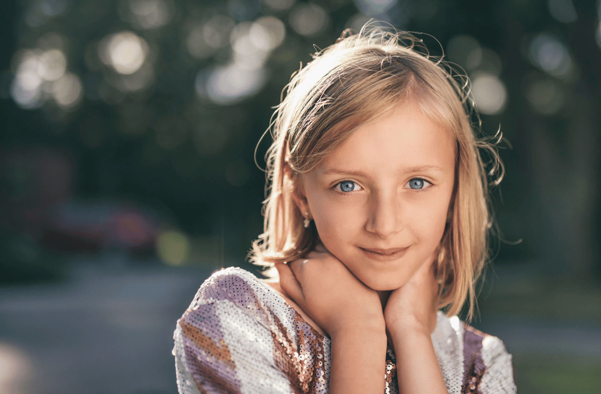 selective focus photography of girl in sequined white-and-pink stripe shirt