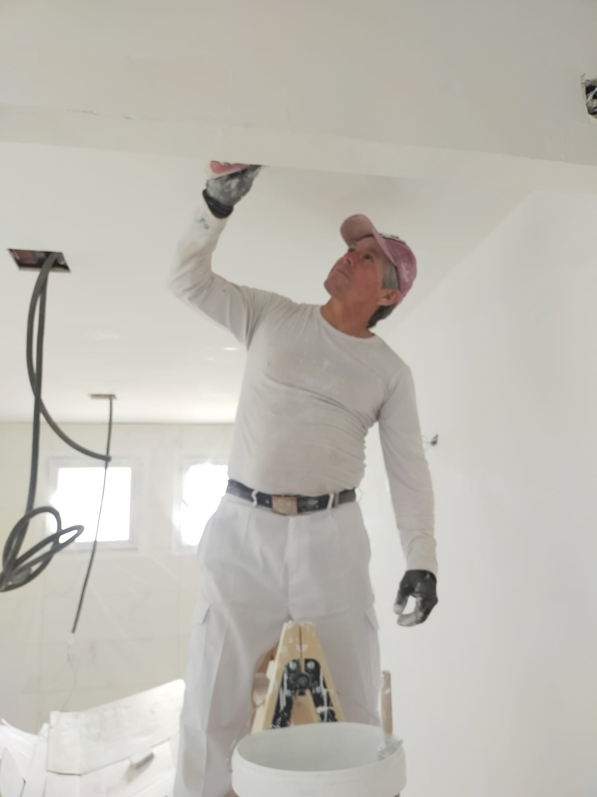 woman wearing yellow long-sleeved dress under white clouds and blue sky during daytime