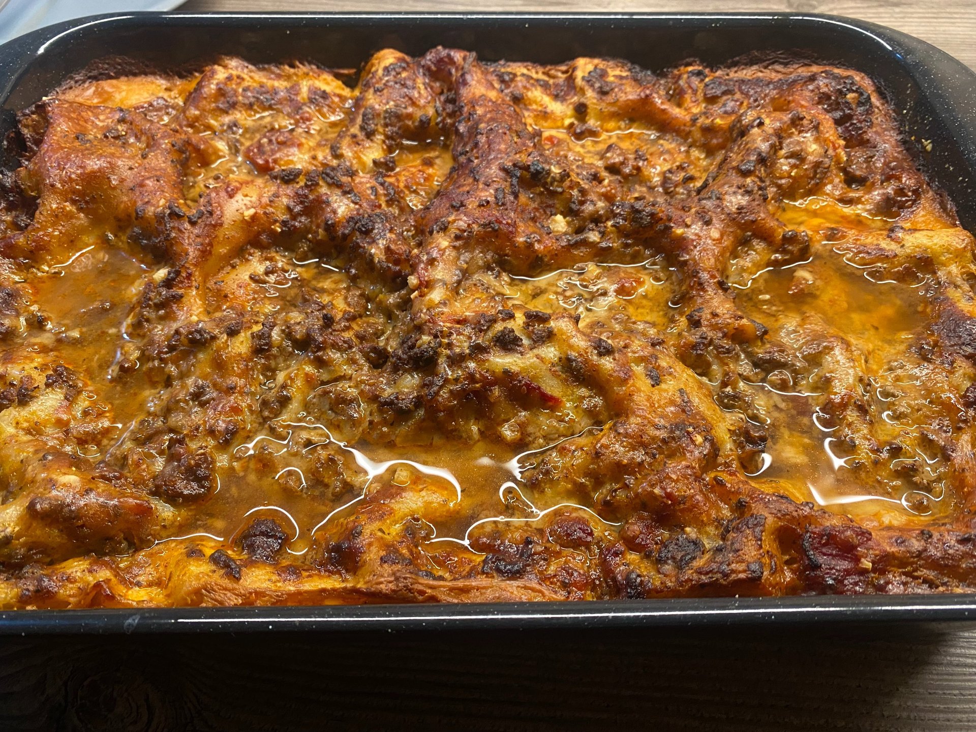 brown and black food on silver tray
