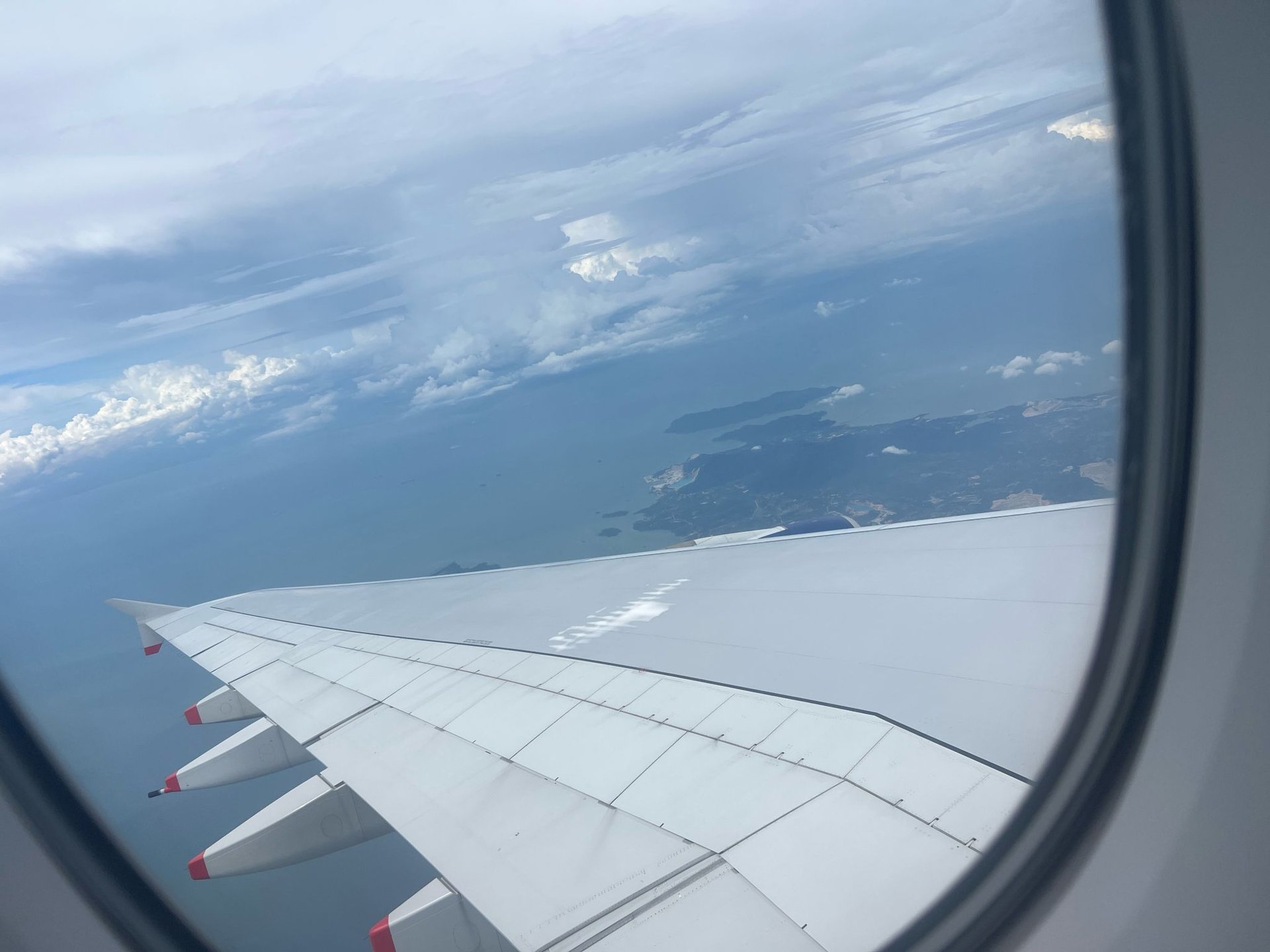 an abstract photo of a curved building with a blue sky in the background