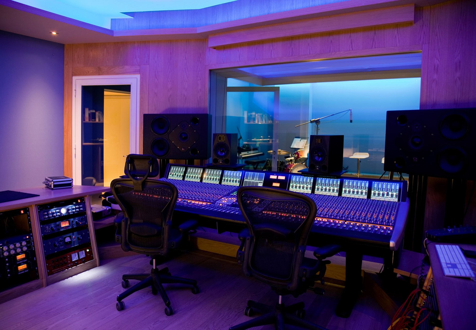 an abstract photo of a curved building with a blue sky in the background