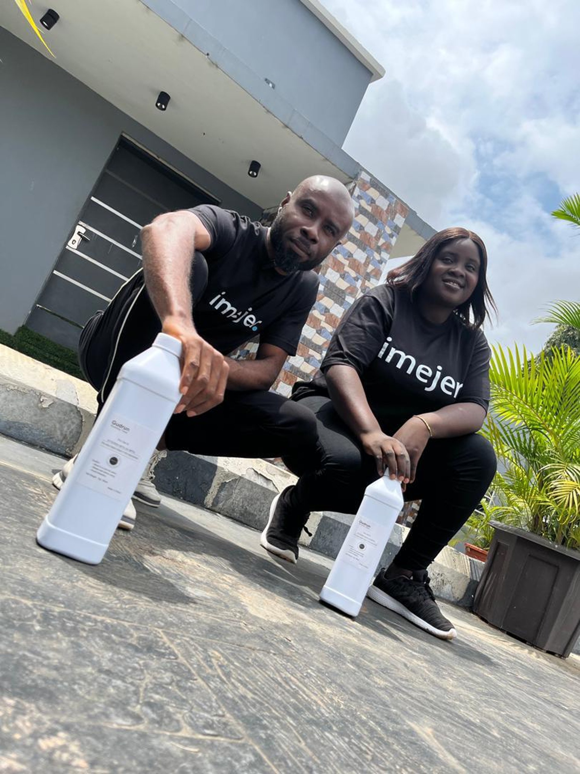 white and brown concrete building near green grass field during daytime