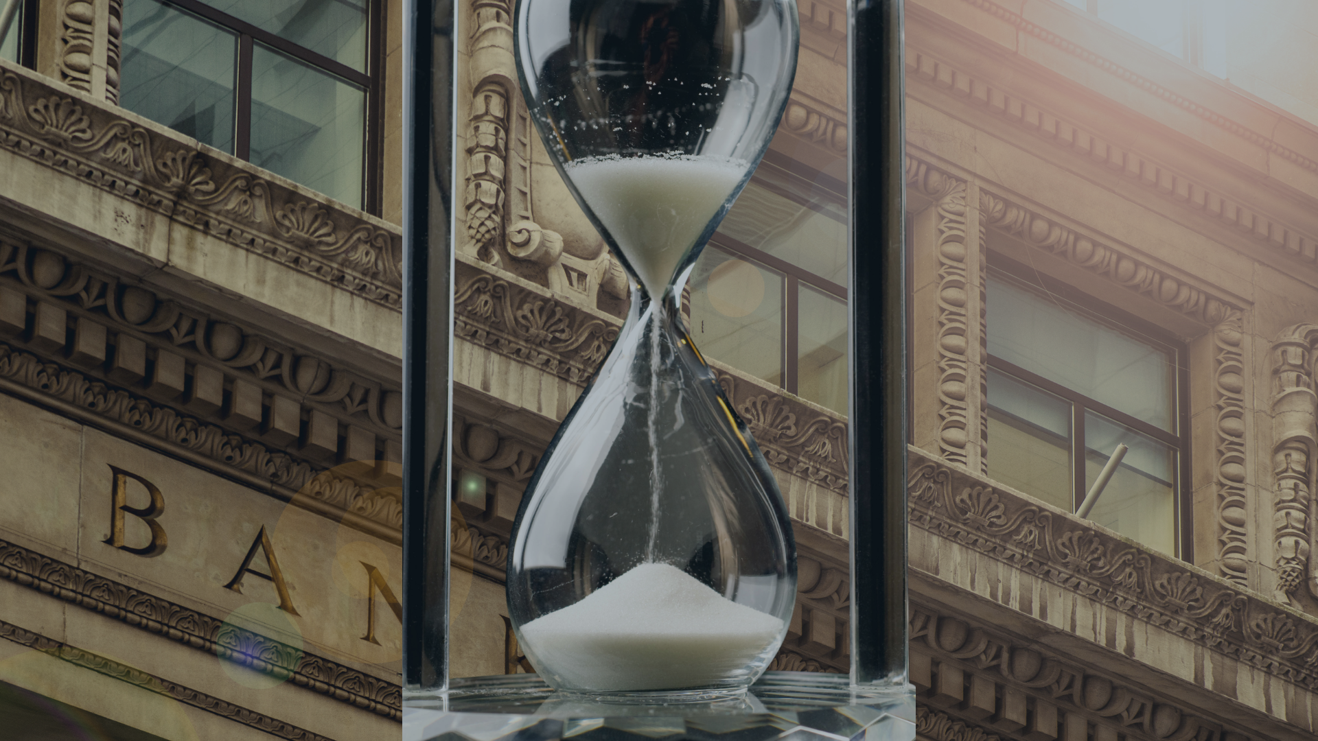 Couple looking stressed over bills at kitchen table.