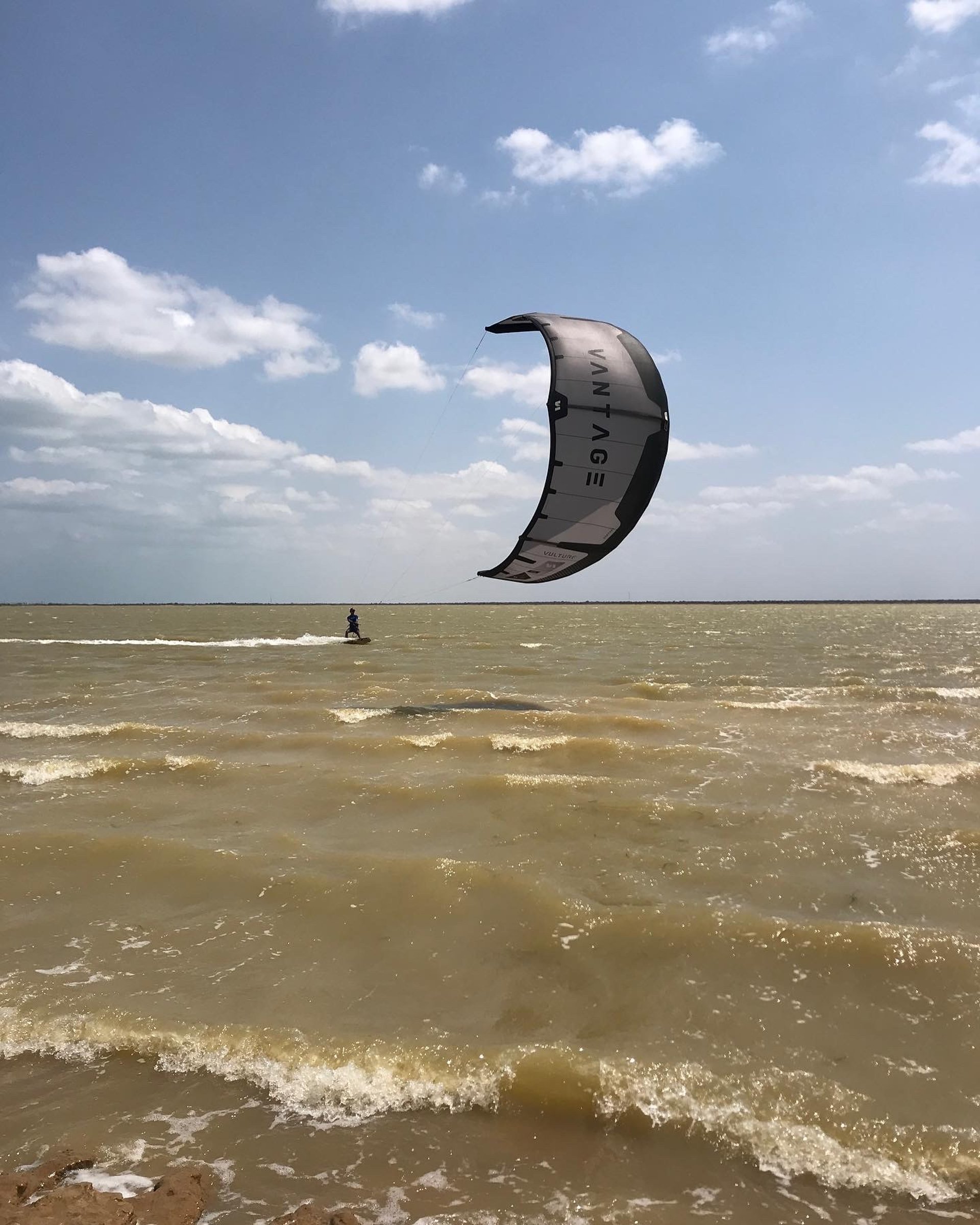 woman wearing yellow long-sleeved dress under white clouds and blue sky during daytime