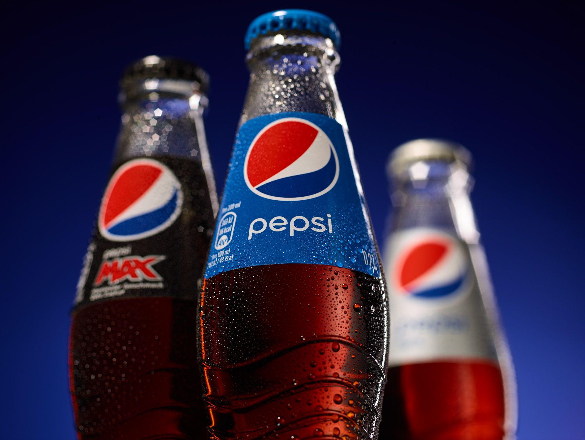 Coca-cola bottle with glasses on a tray