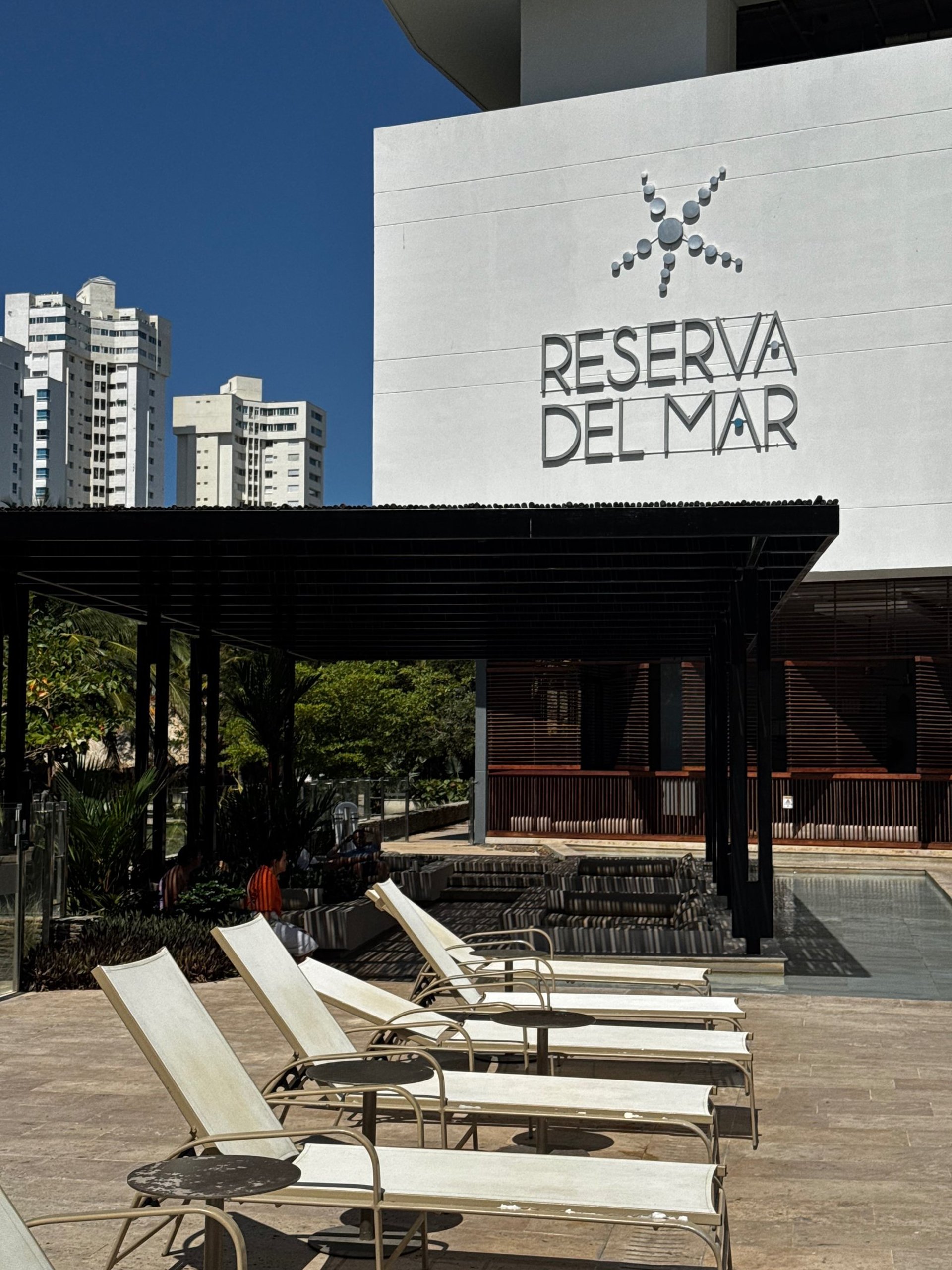 an abstract photo of a curved building with a blue sky in the background
