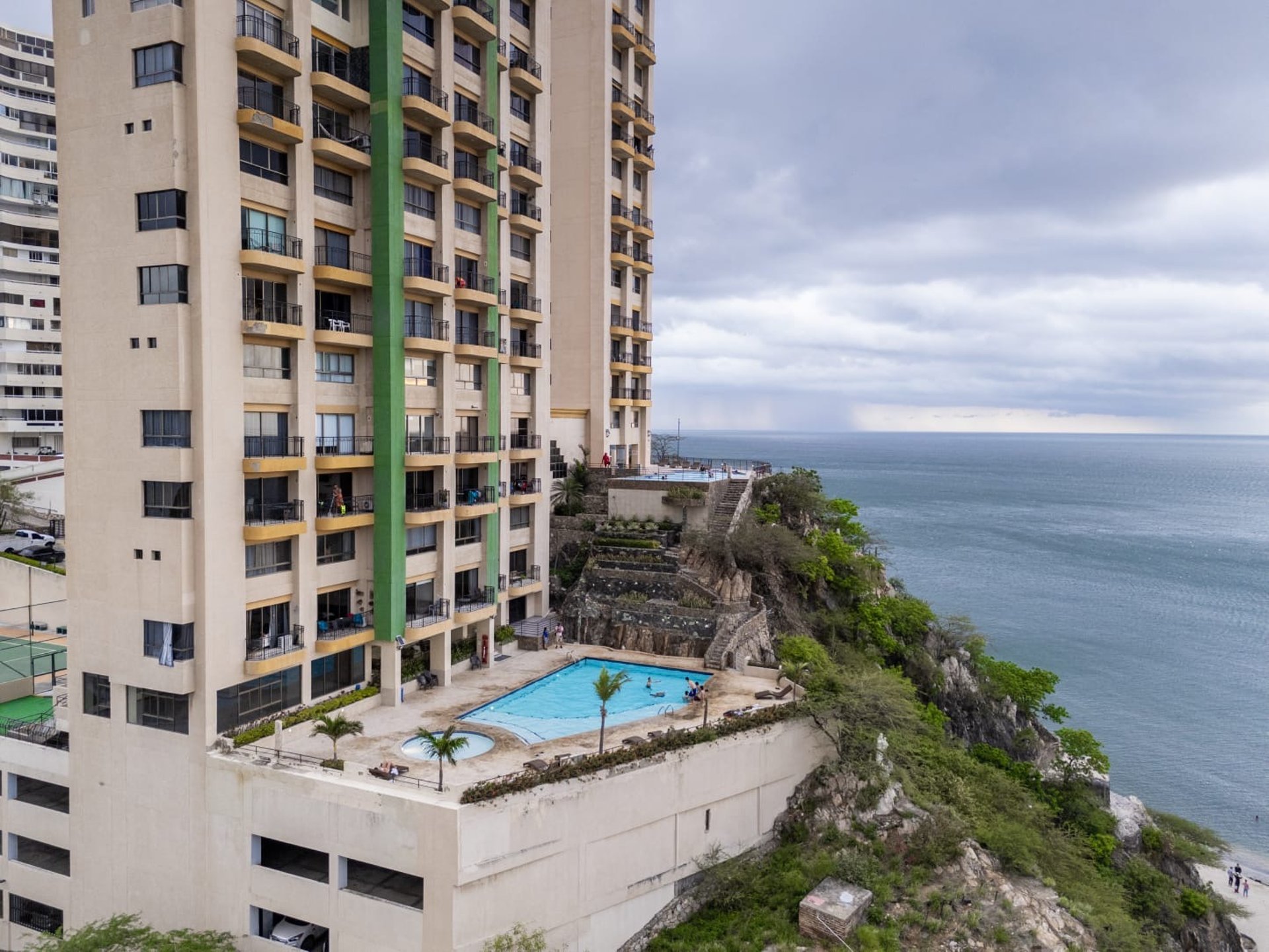 an abstract photo of a curved building with a blue sky in the background
