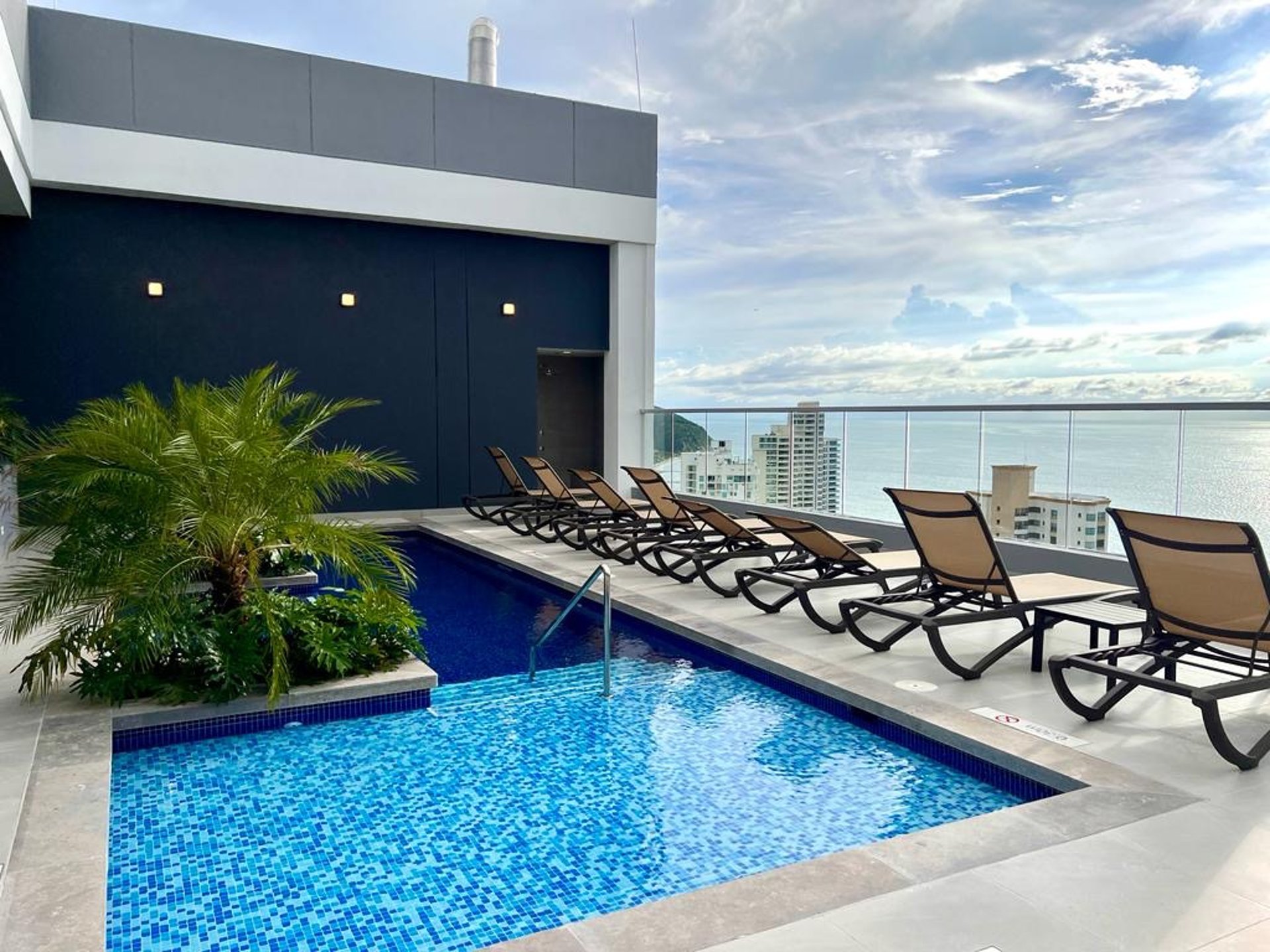 an abstract photo of a curved building with a blue sky in the background