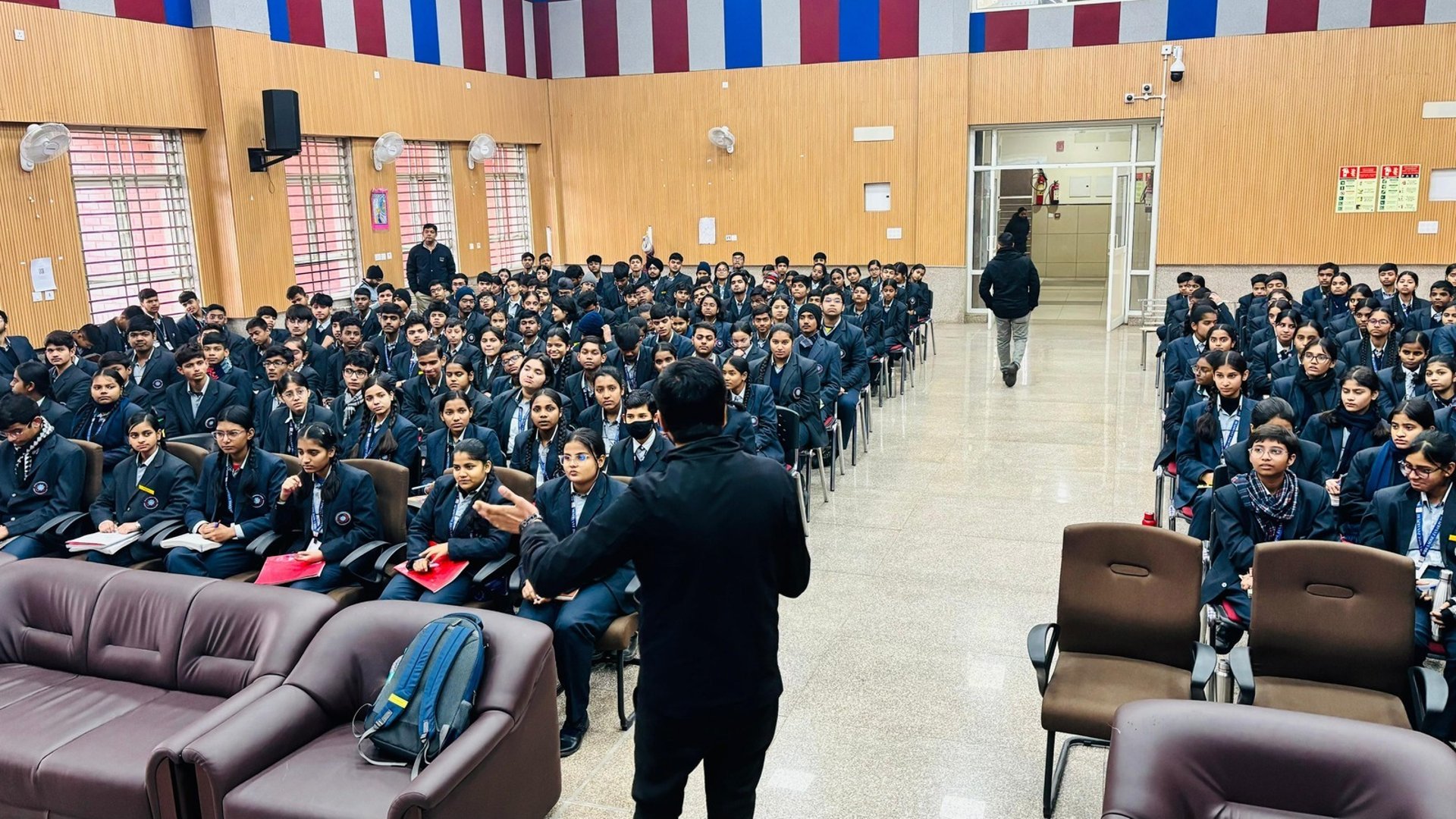 an abstract photo of a curved building with a blue sky in the background