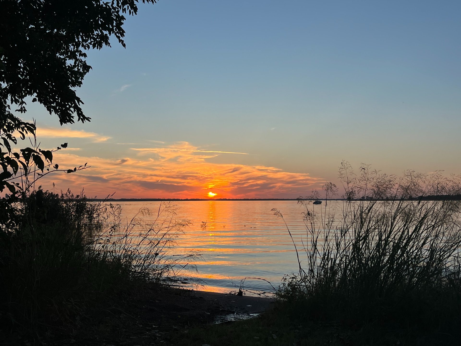 woman wearing yellow long-sleeved dress under white clouds and blue sky during daytime