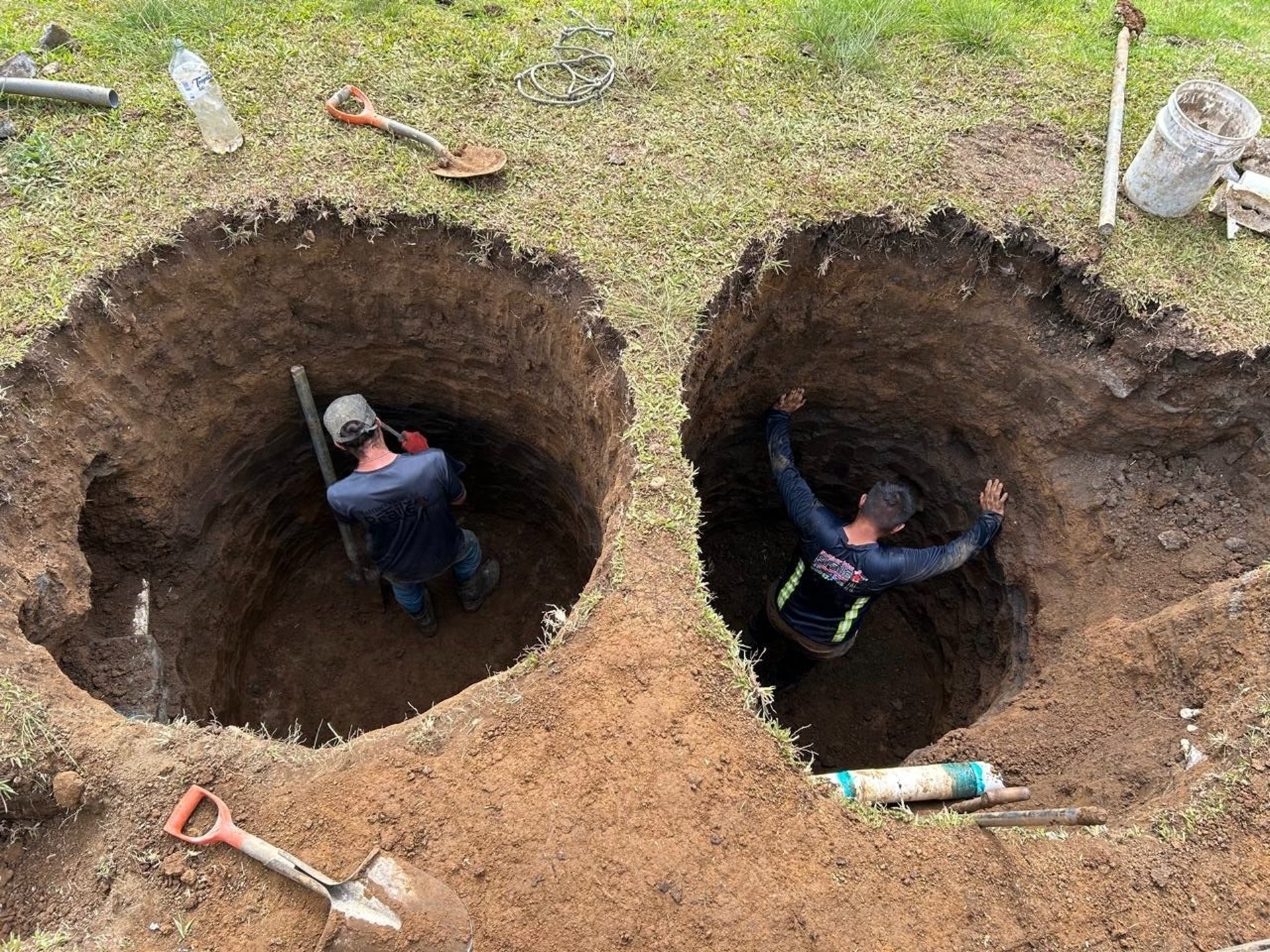A man sanding a wooden table with a sander
