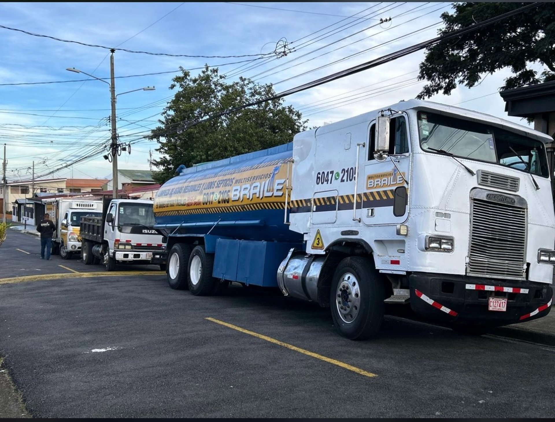 man wearing black jacket holding rod