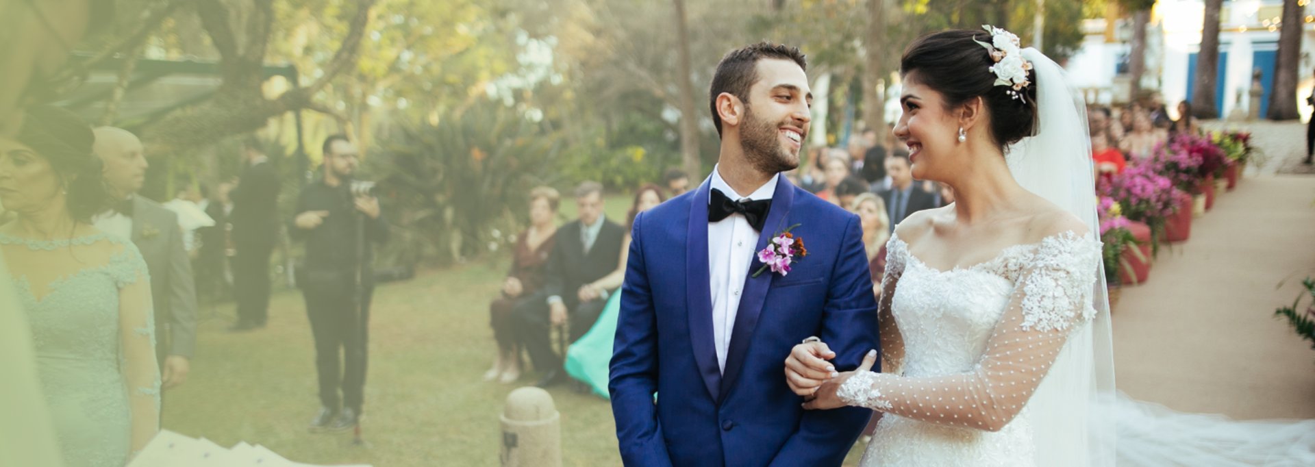 gold wedding band on white textile