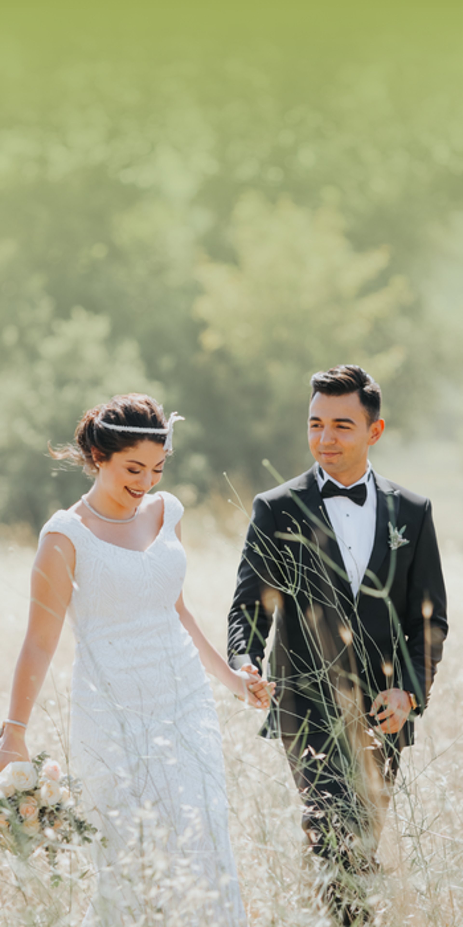 gold wedding band on white textile