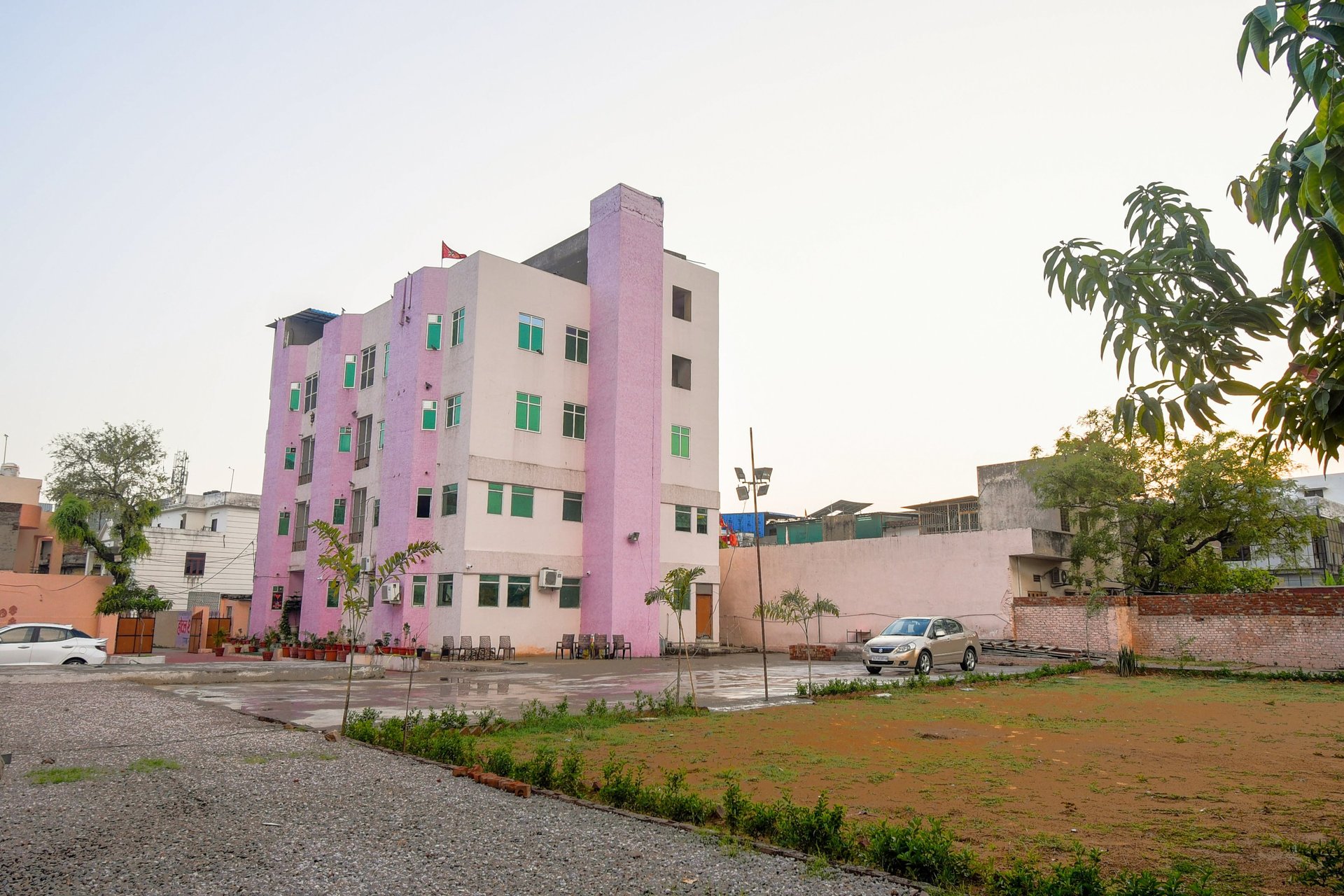 sunloungers fronting buildings near mountain