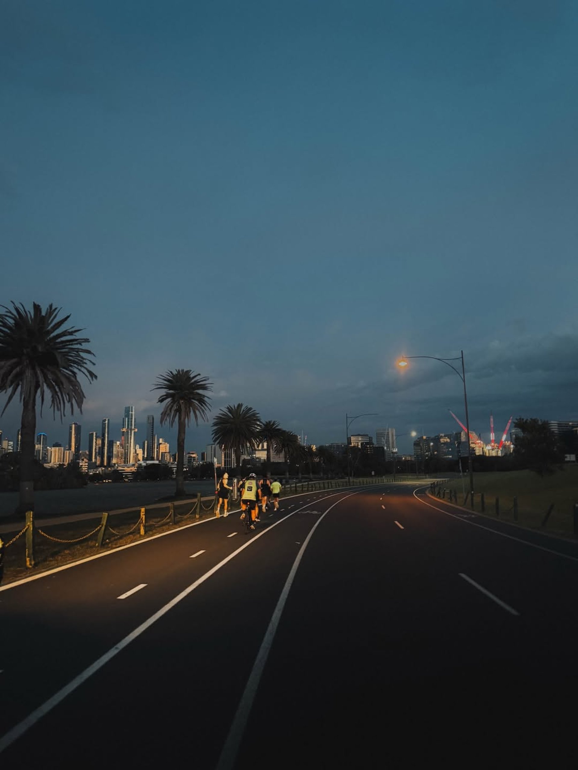 an abstract photo of a curved building with a blue sky in the background