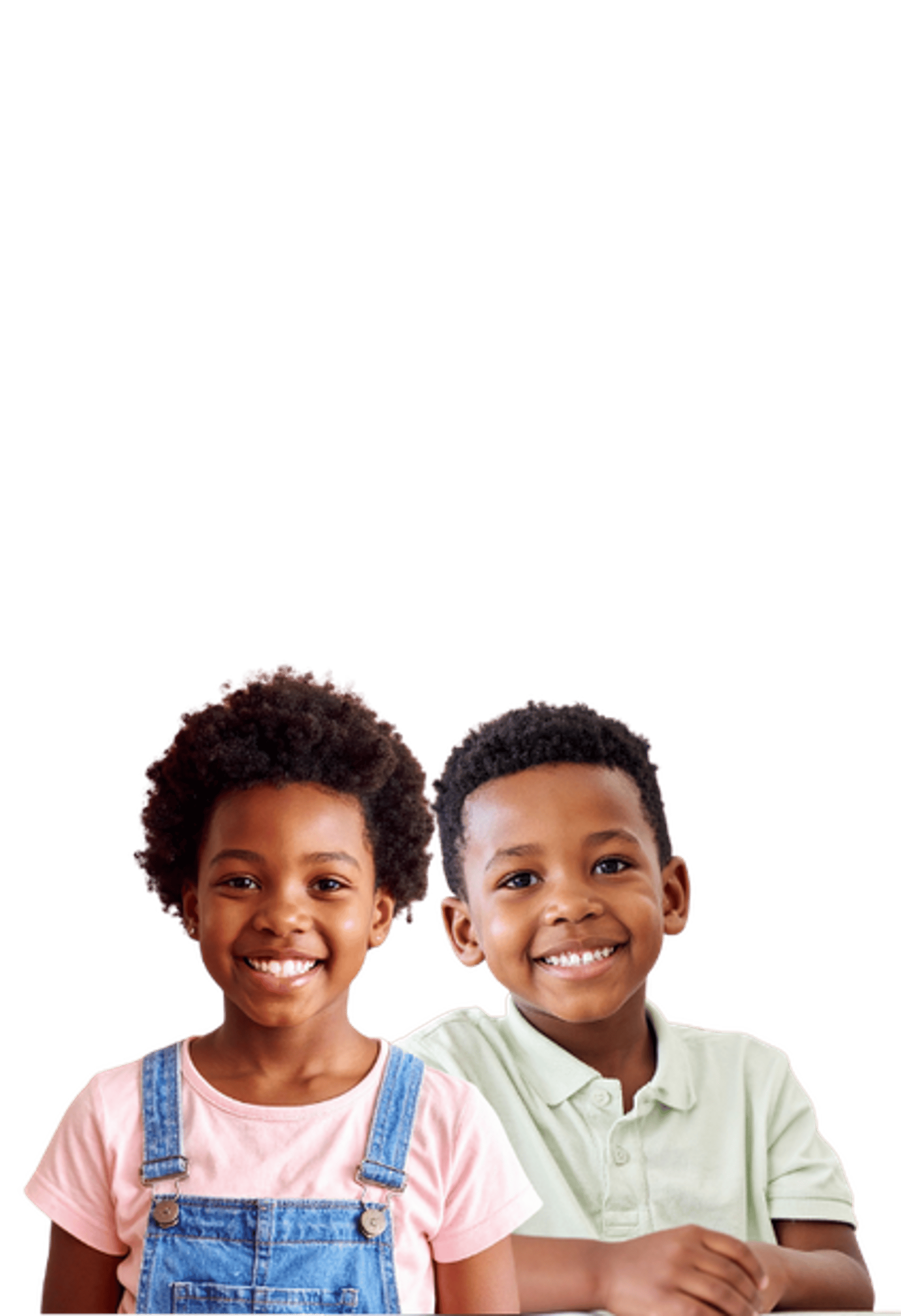 white and brown concrete building near green grass field during daytime