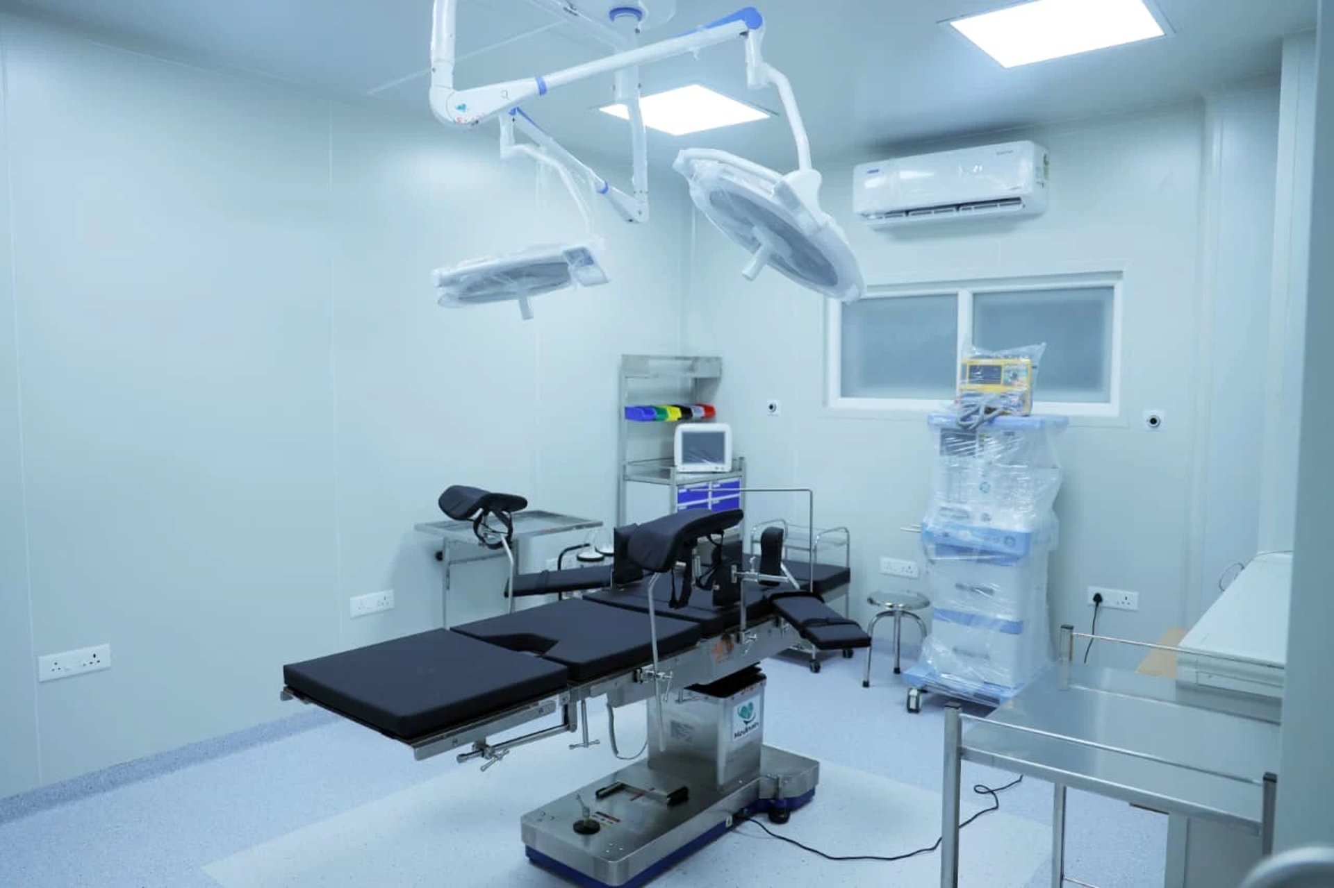 black and white bed near brown wooden table