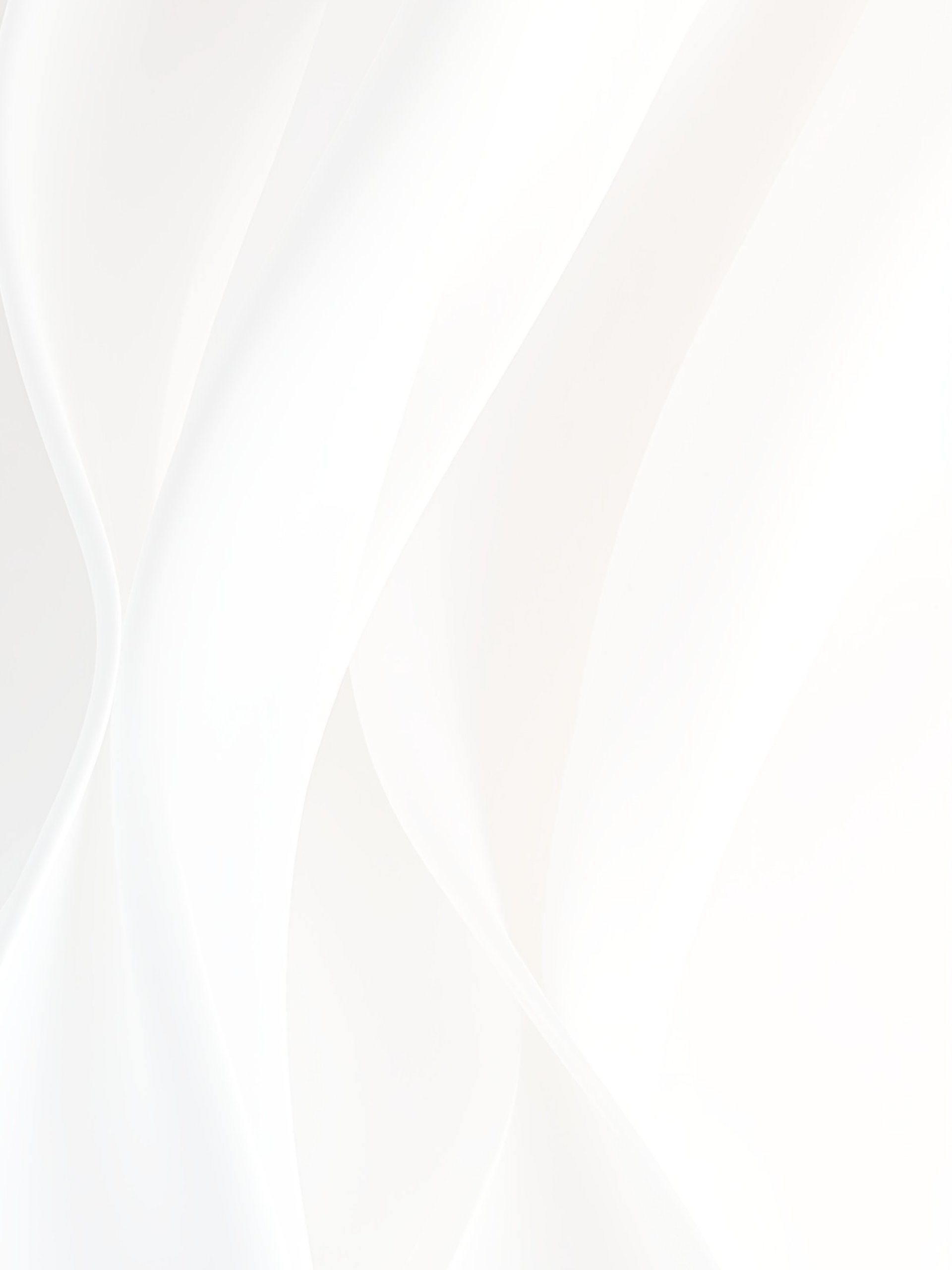 A white object is hanging from a string