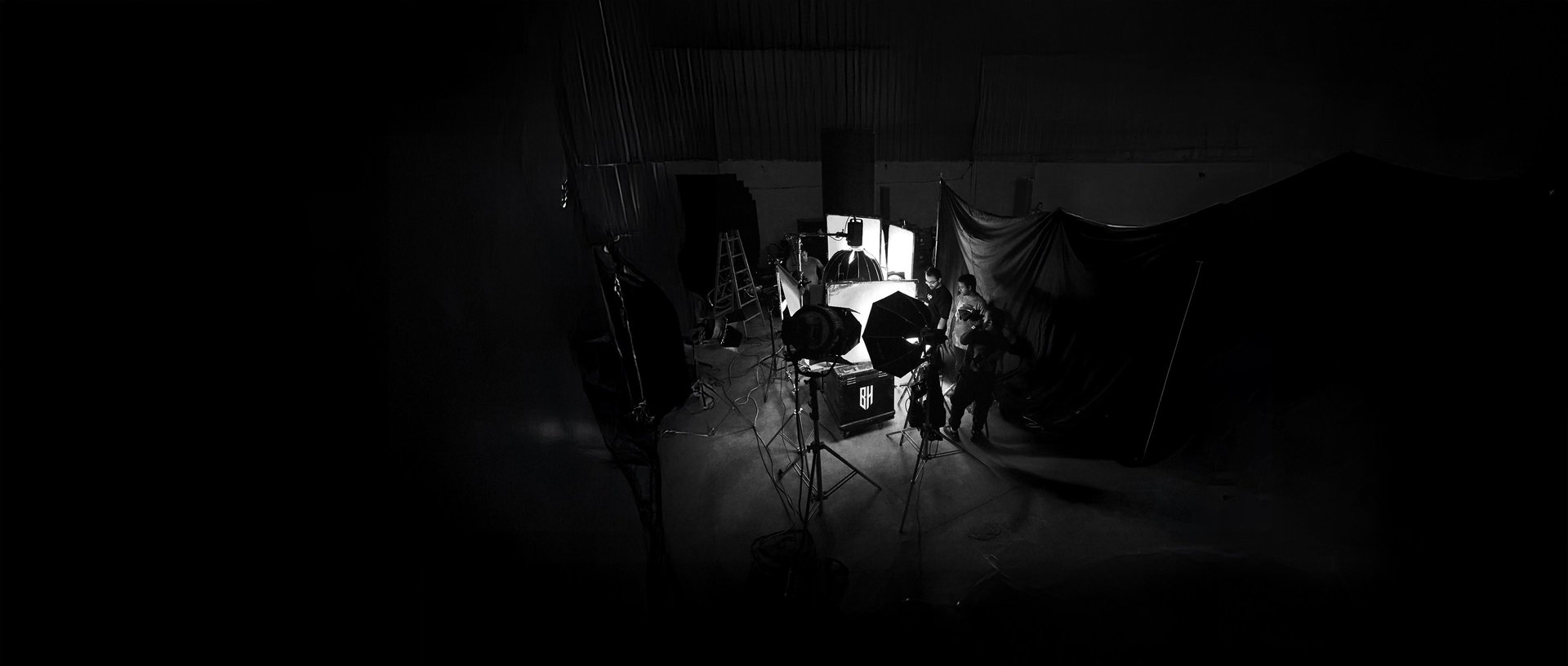 a couple of people standing in front of a camera