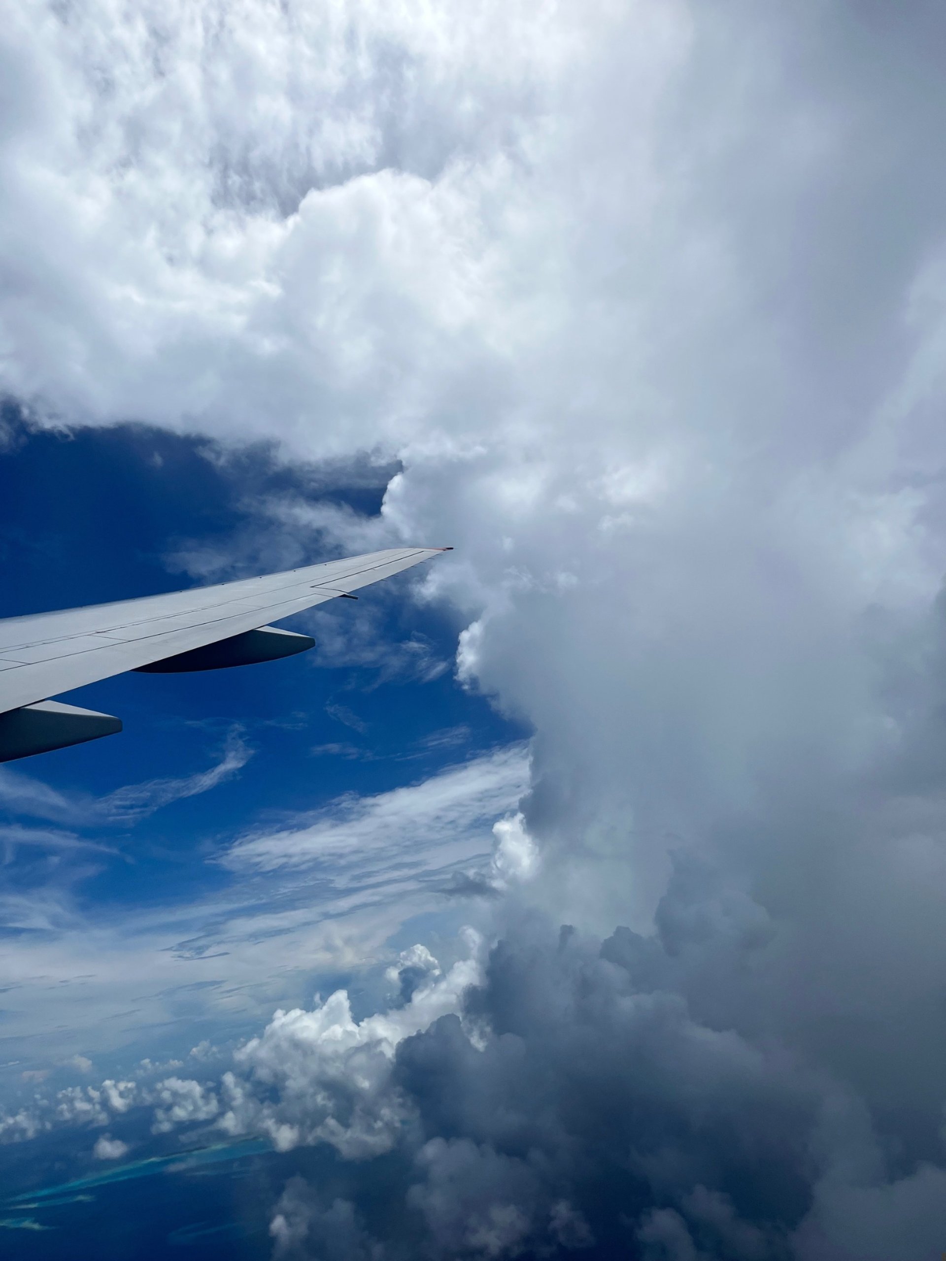 passenger plane flying over clouds