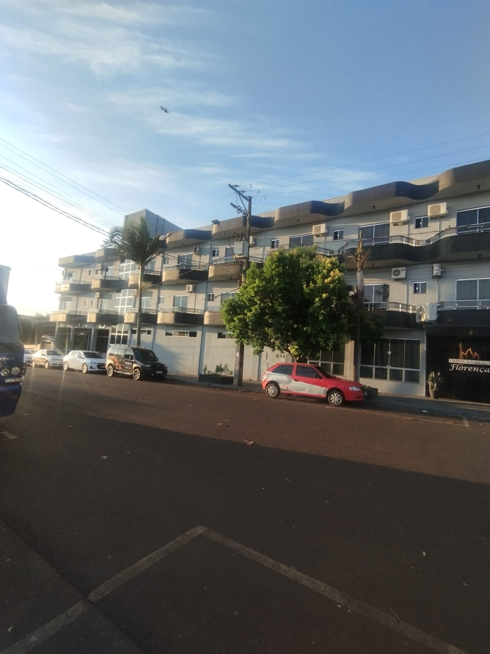 woman wearing yellow long-sleeved dress under white clouds and blue sky during daytime