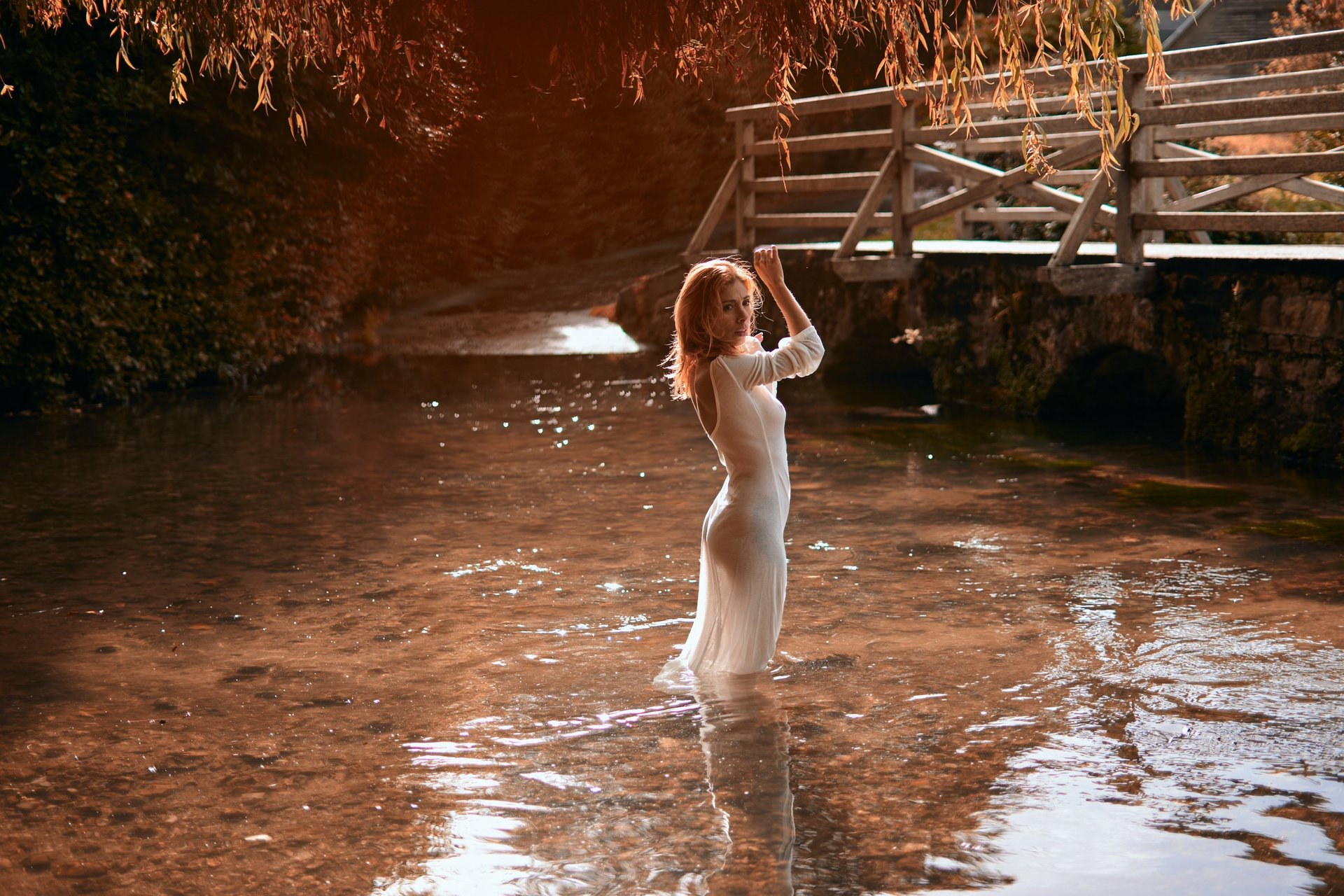 an abstract photo of a curved building with a blue sky in the background