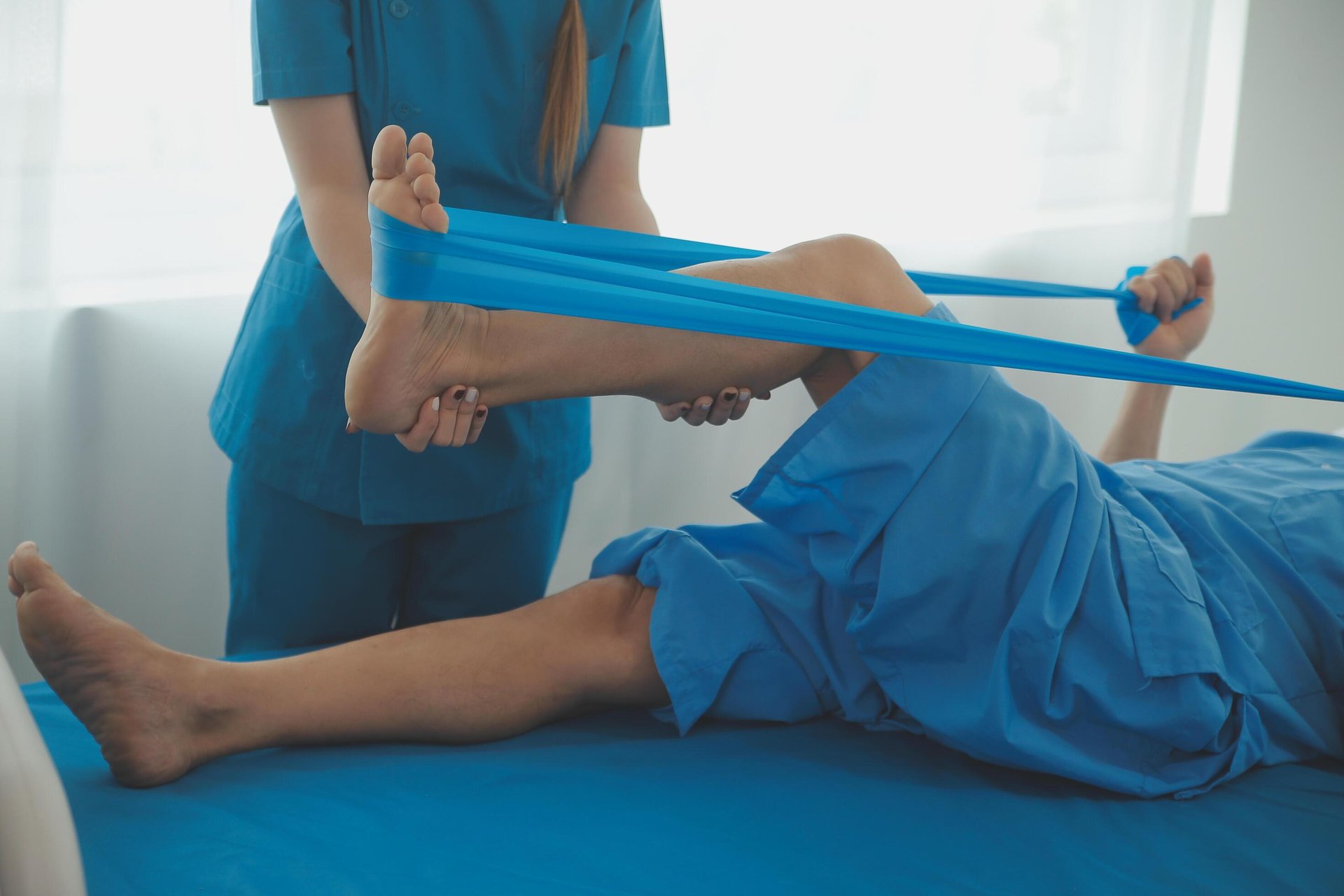 person massaging the back of a woman