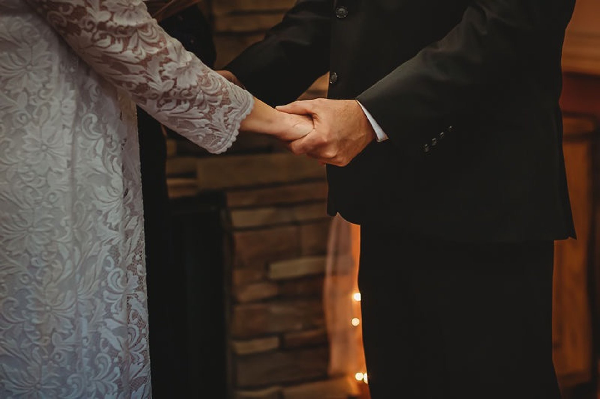 man and woman holding hands focus photo