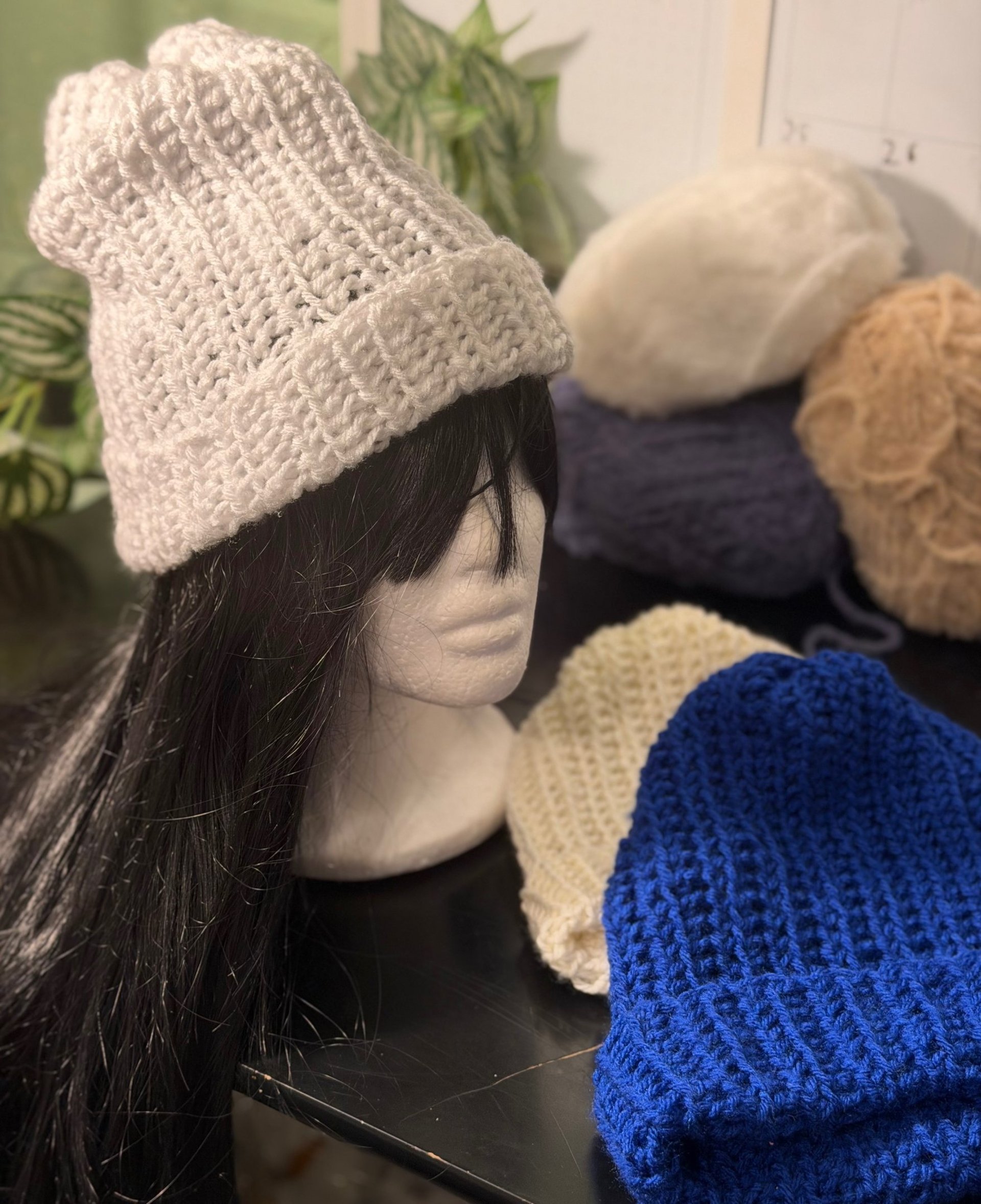 person wearing grey knit sweater