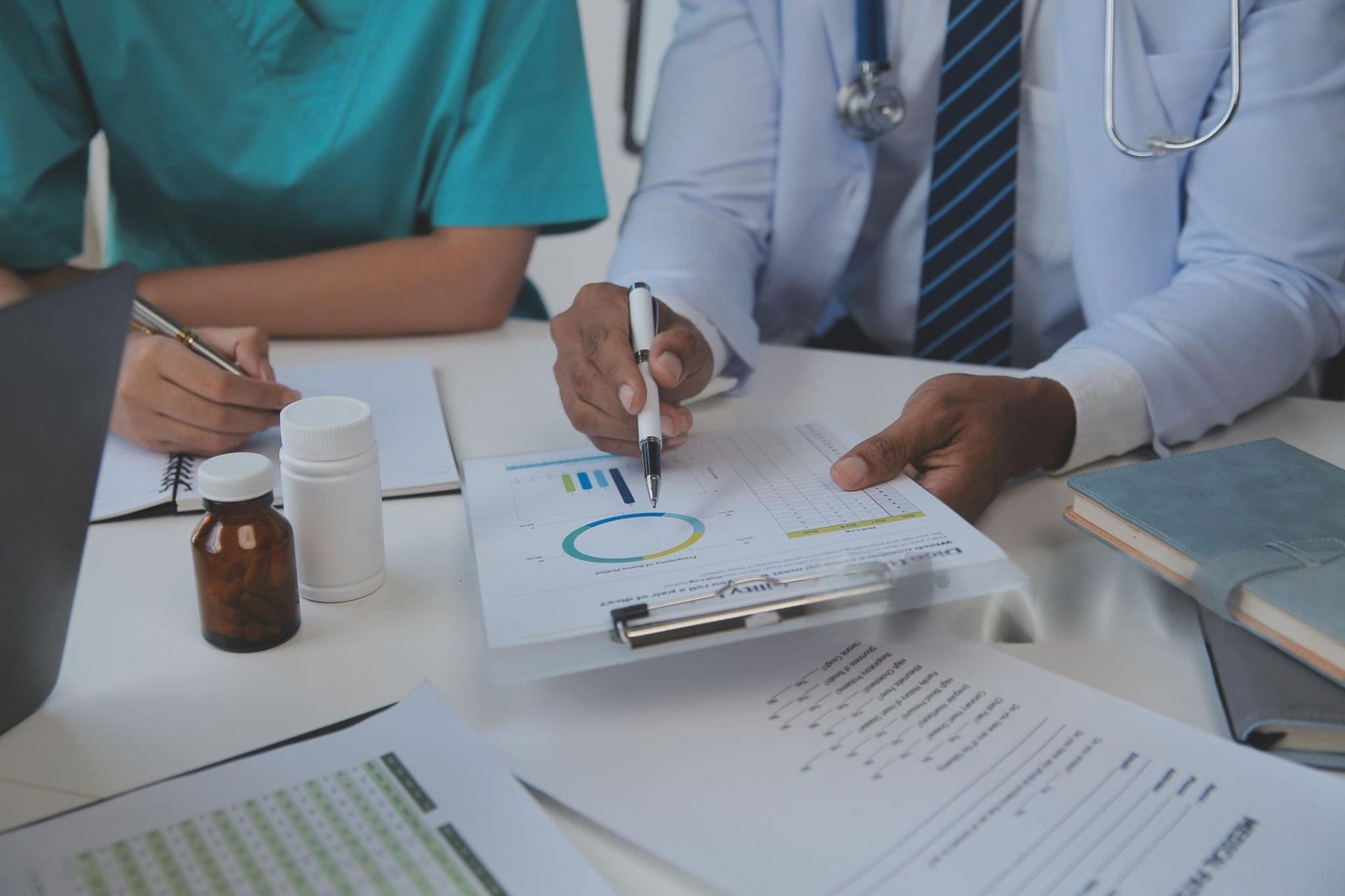 a woman measuring her waist with a measuring tape