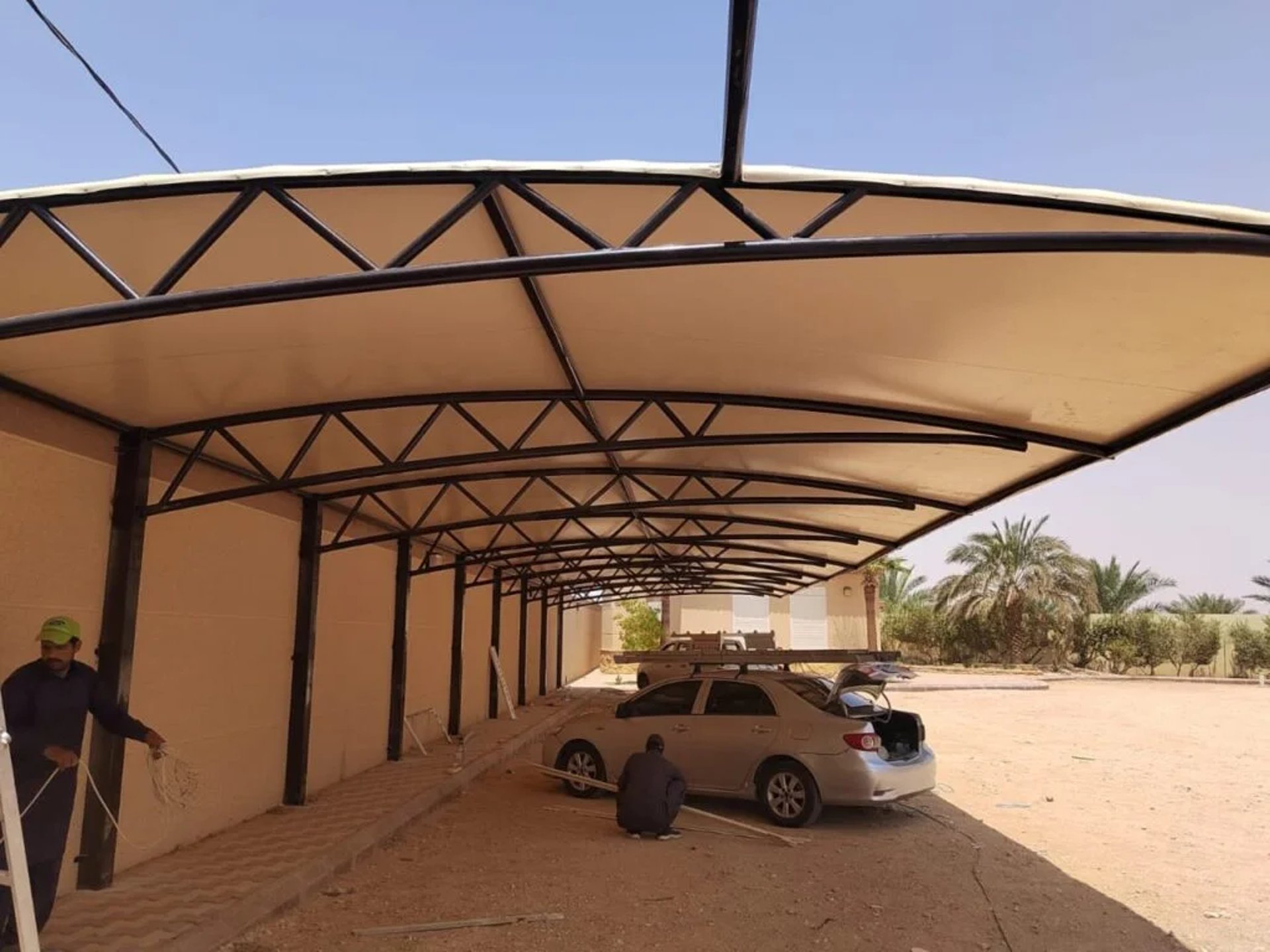 an abstract photo of a curved building with a blue sky in the background