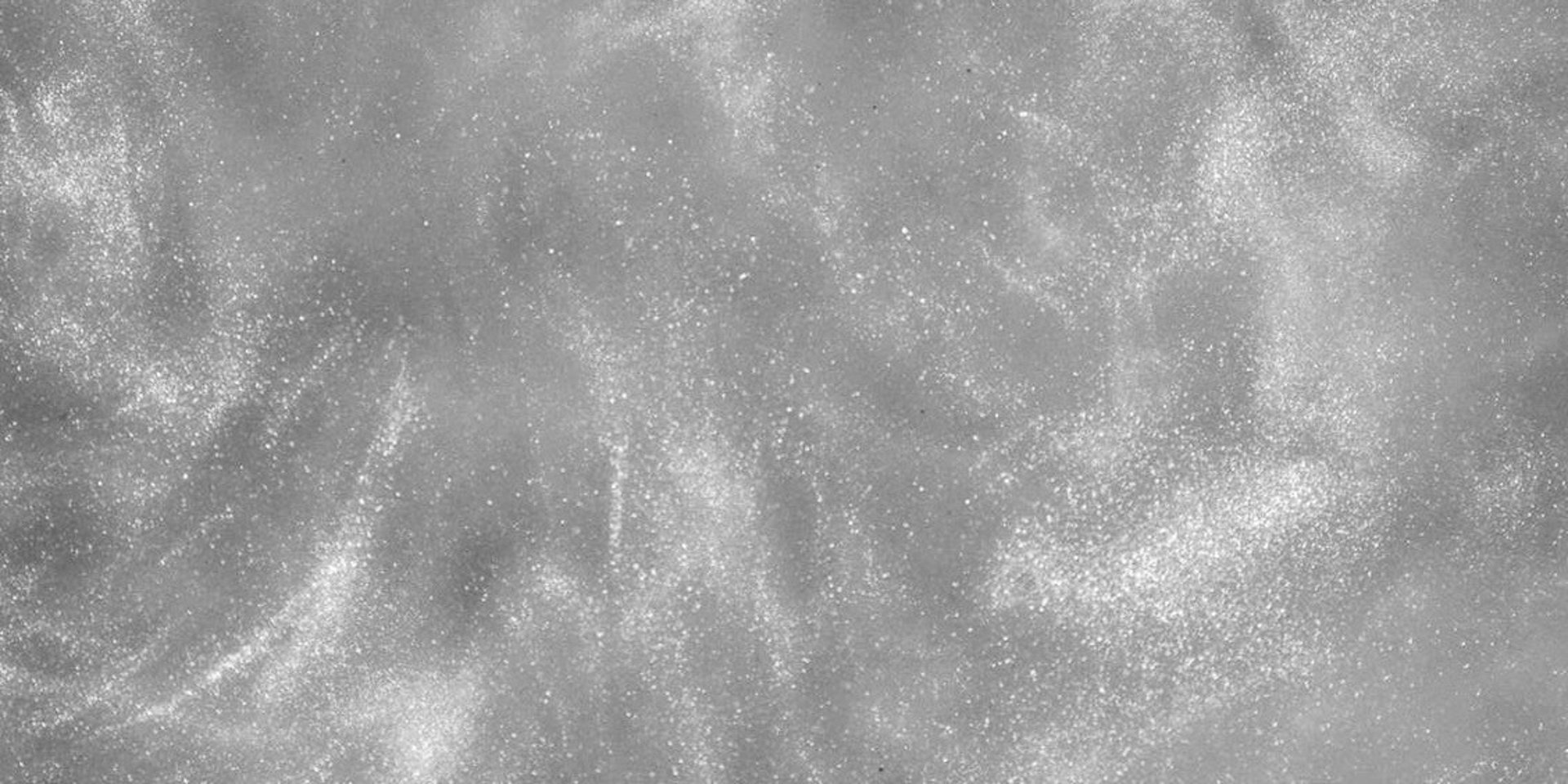 person wearing grey knit sweater