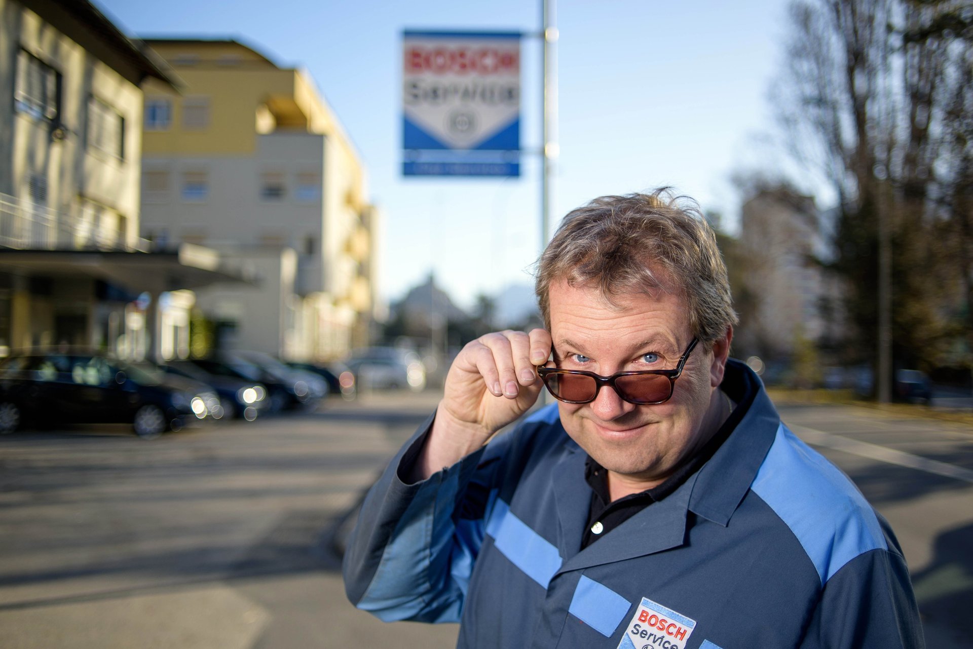 an abstract photo of a curved building with a blue sky in the background