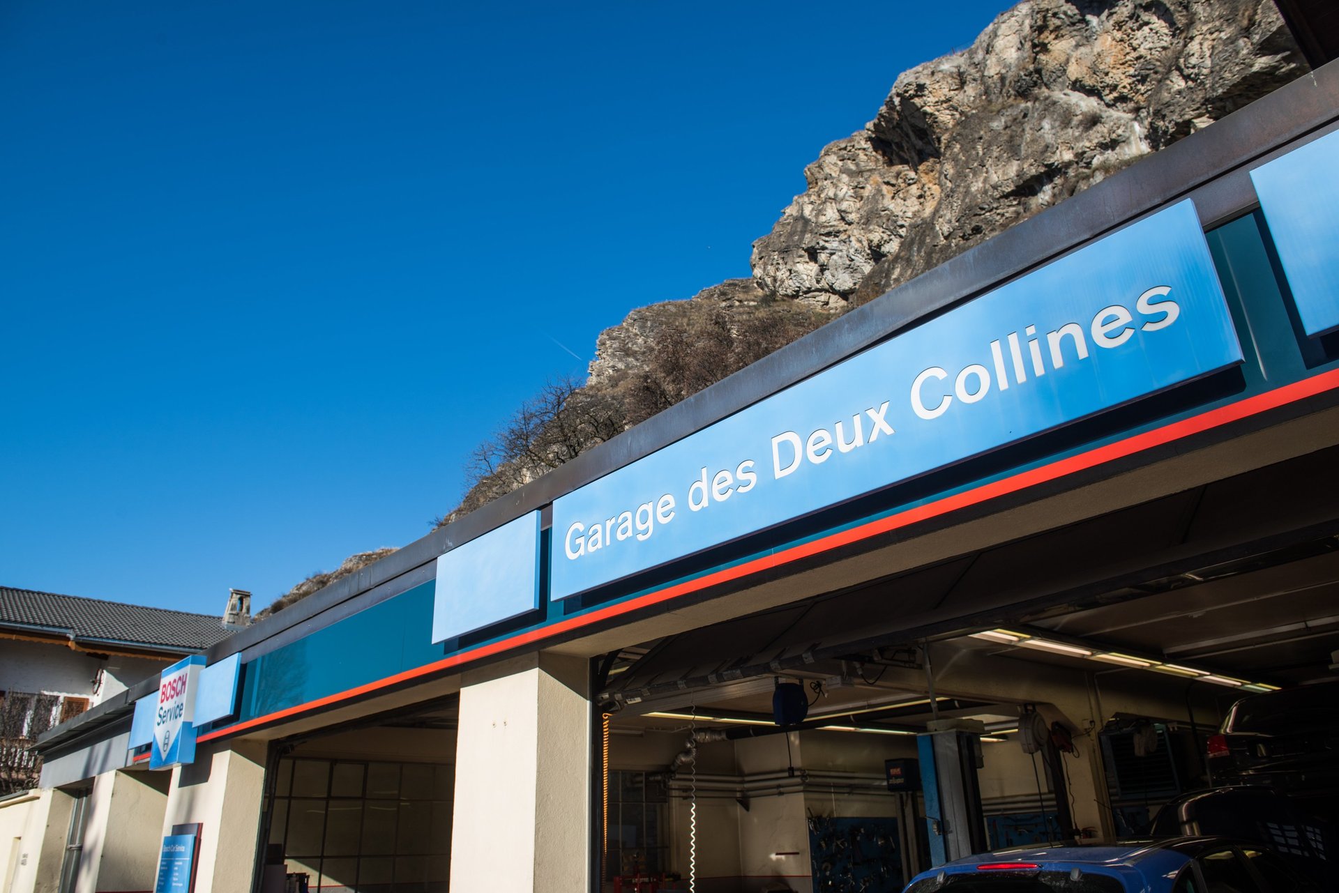 an abstract photo of a curved building with a blue sky in the background