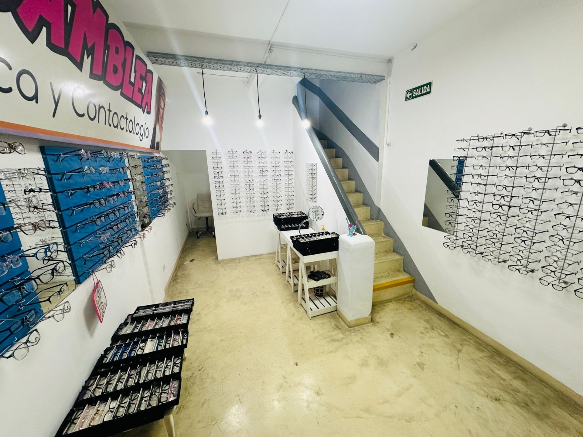 an abstract photo of a curved building with a blue sky in the background