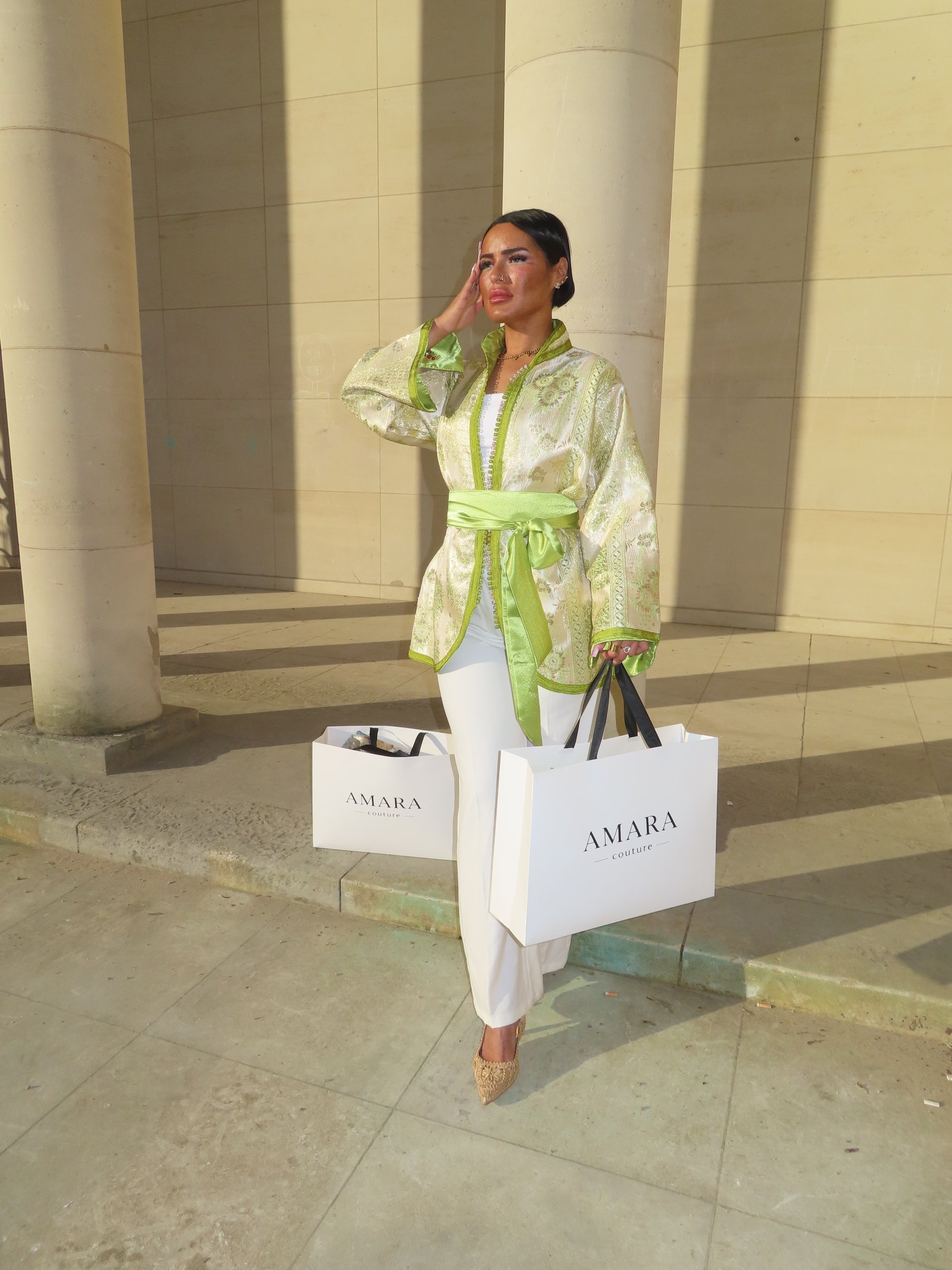 woman wearing yellow long-sleeved dress under white clouds and blue sky during daytime