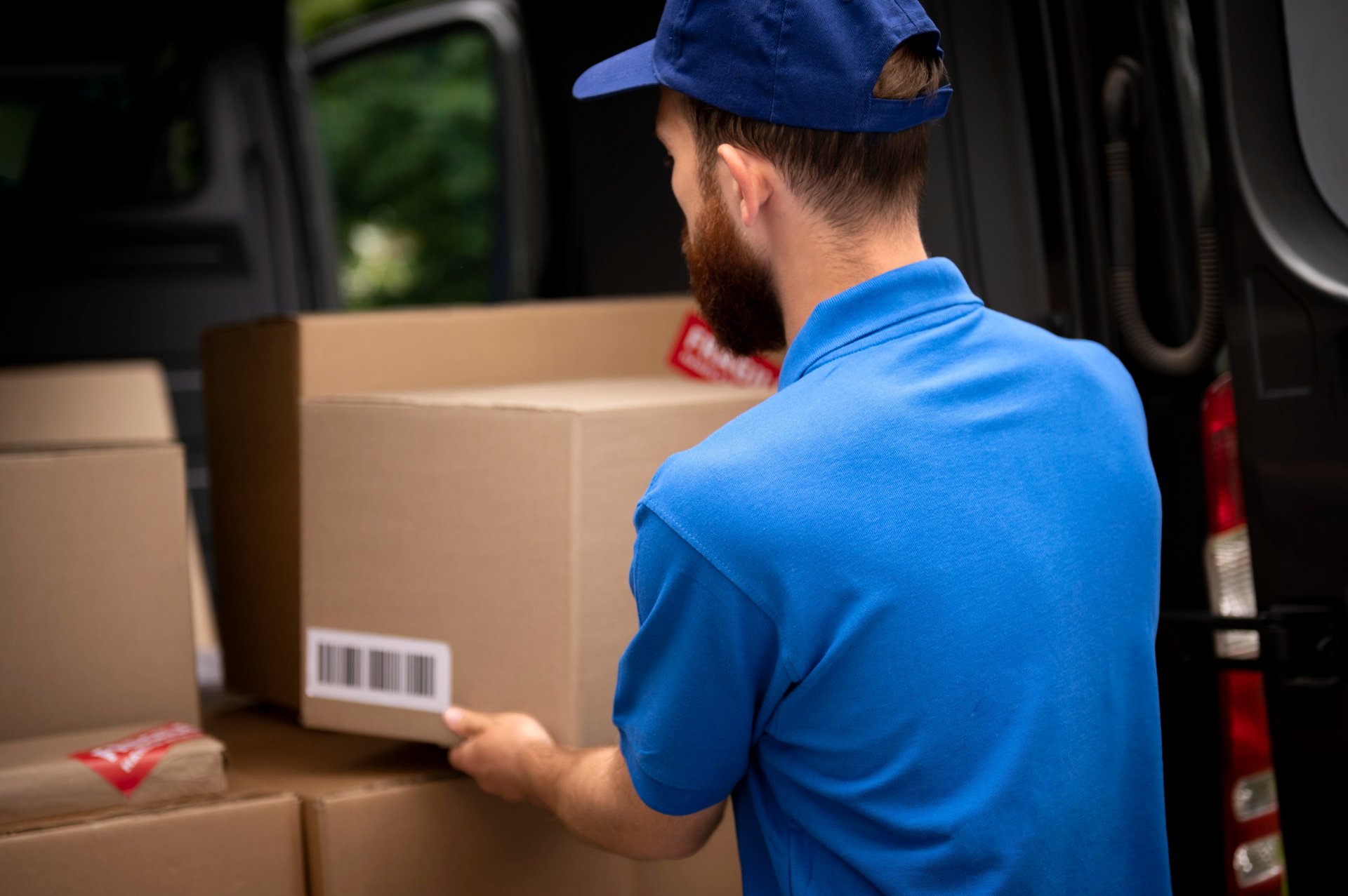 A man sanding a wooden table with a sander