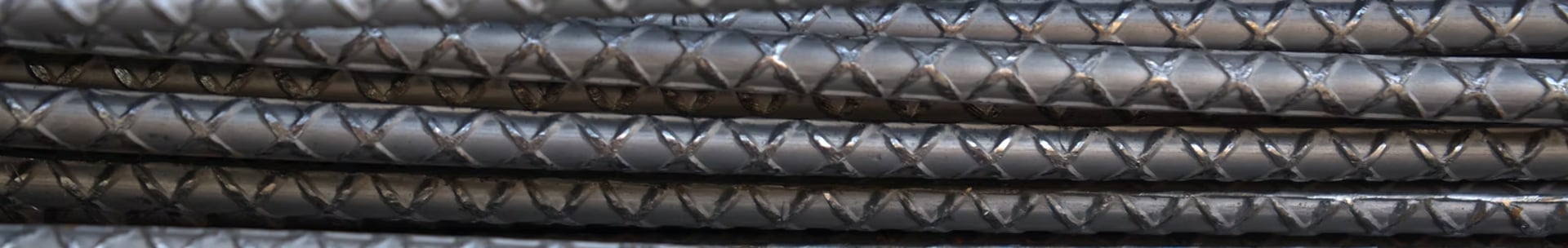 an abstract photo of a curved building with a blue sky in the background