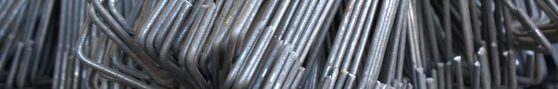 an abstract photo of a curved building with a blue sky in the background