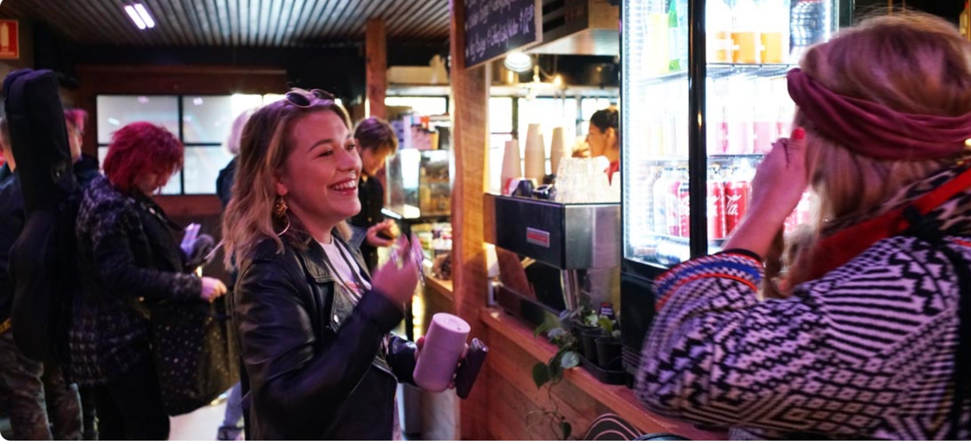 man in black suit jacket smiling