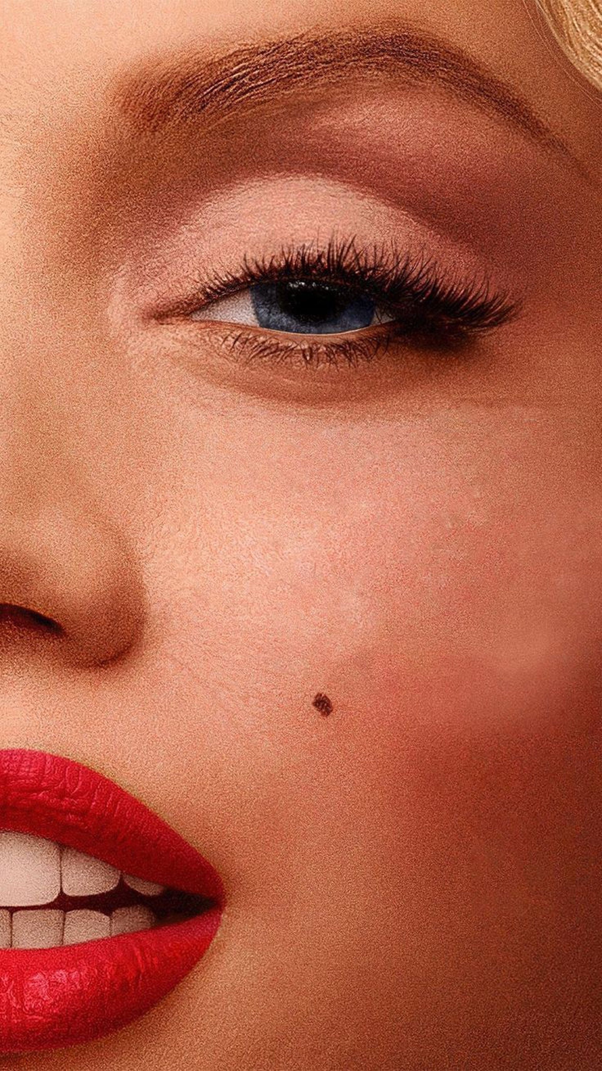 an abstract photo of a curved building with a blue sky in the background