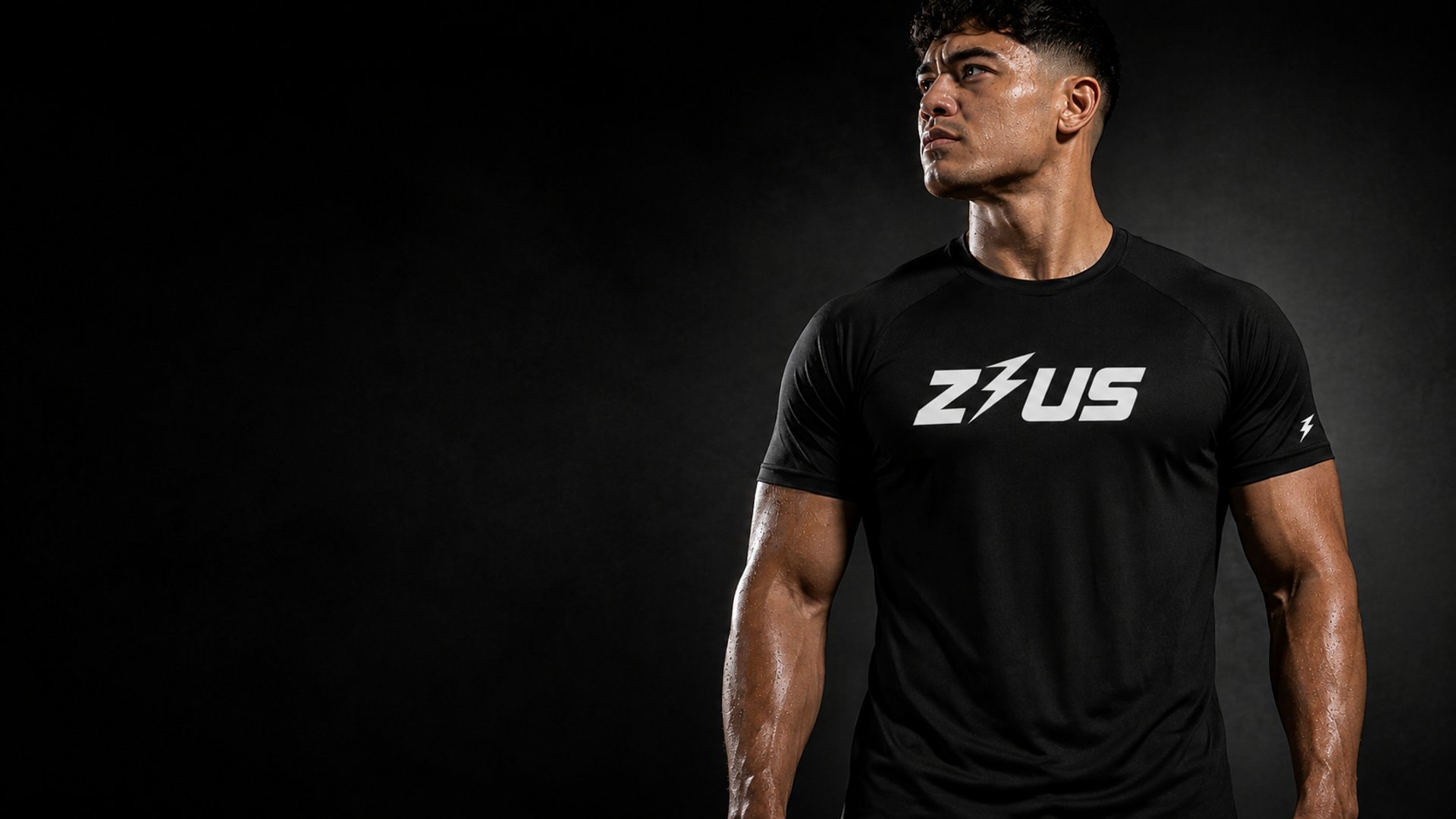 Male athlete in black Zeus performance gym t-shirt for premium men's activewear NZ.