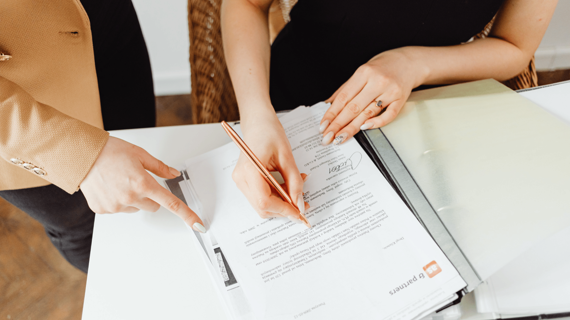an abstract photo of a curved building with a blue sky in the background