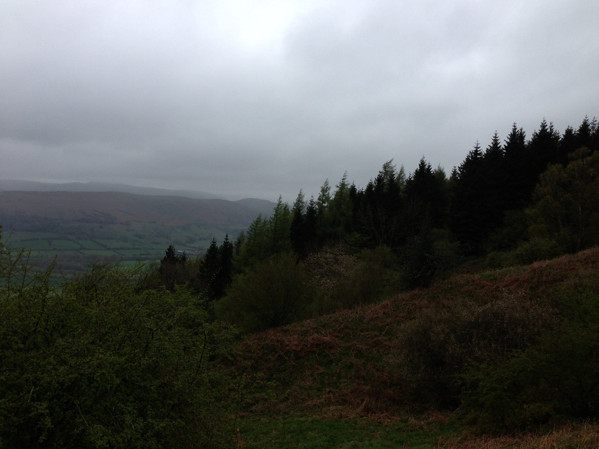 a laptop computer sitting on top of a wooden desk