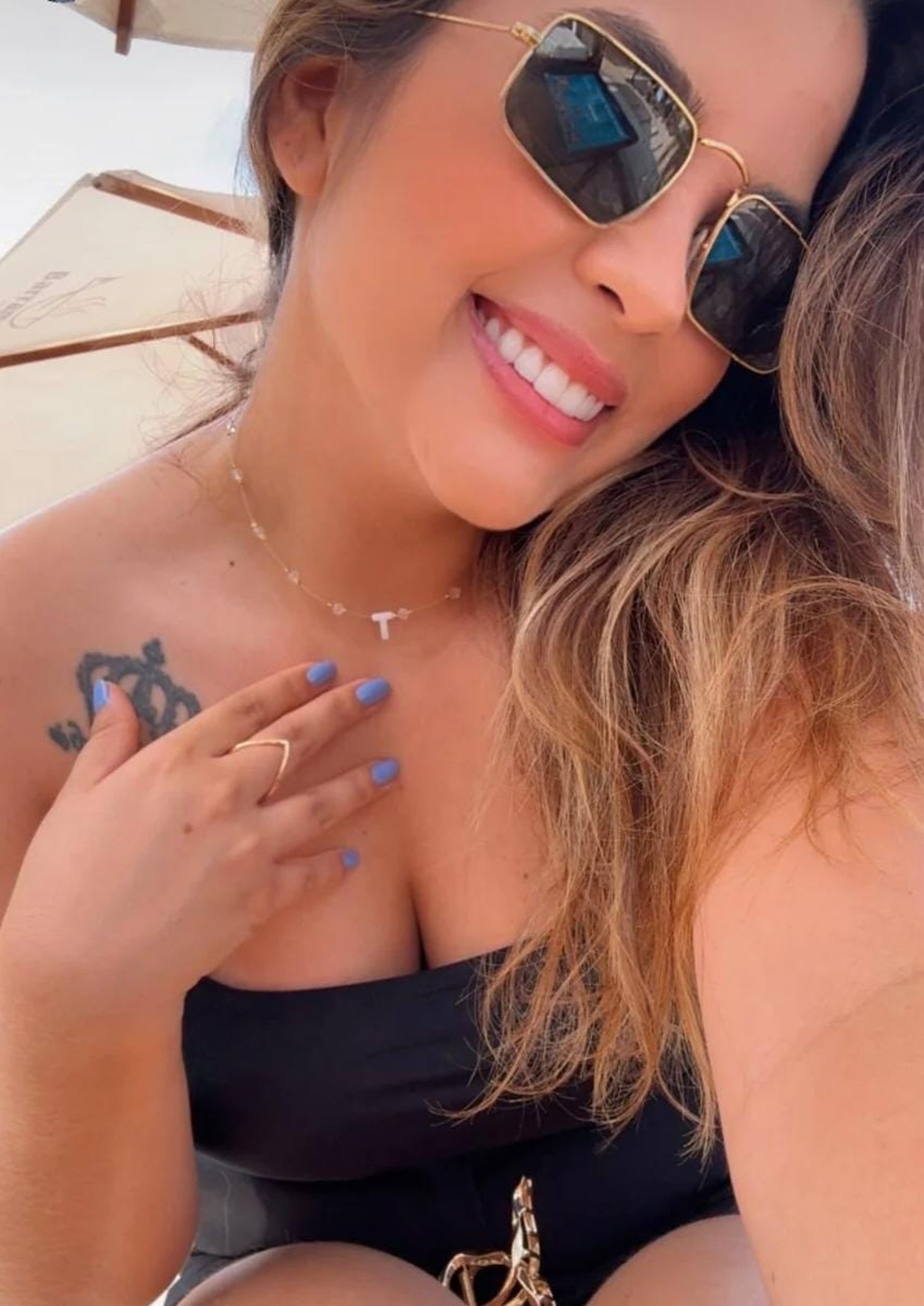 an abstract photo of a curved building with a blue sky in the background