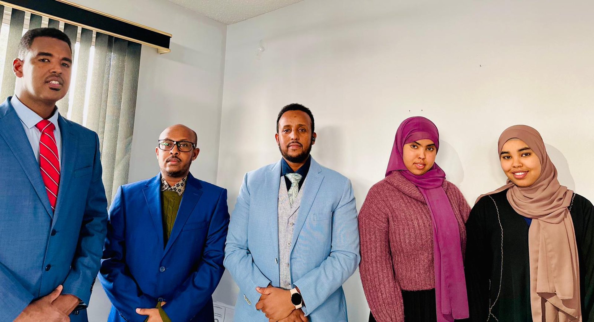 an abstract photo of a curved building with a blue sky in the background