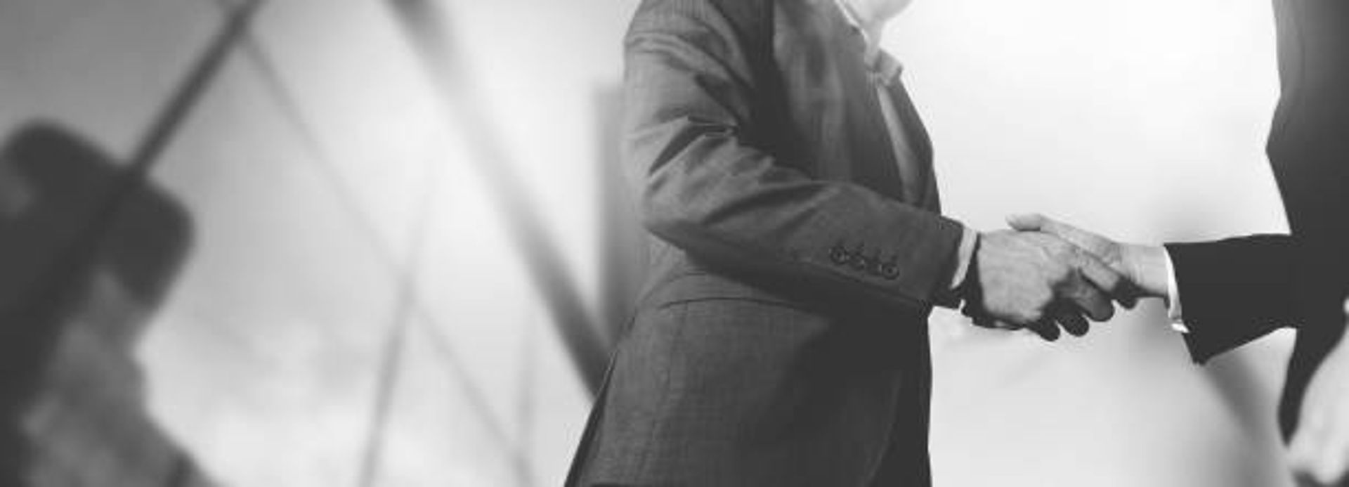 an abstract photo of a curved building with a blue sky in the background