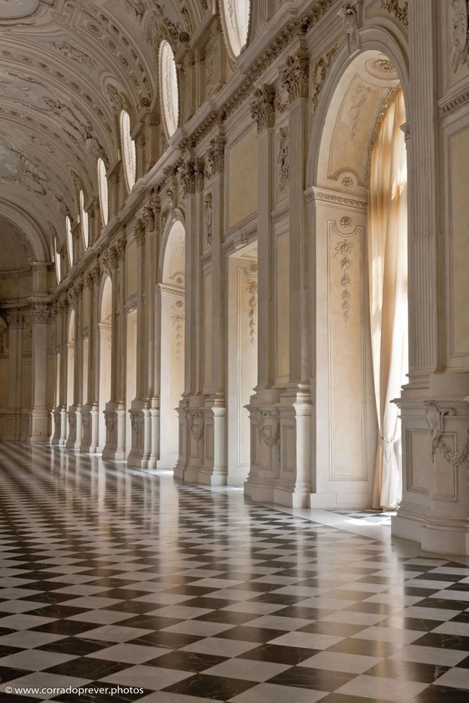 an abstract photo of a curved building with a blue sky in the background